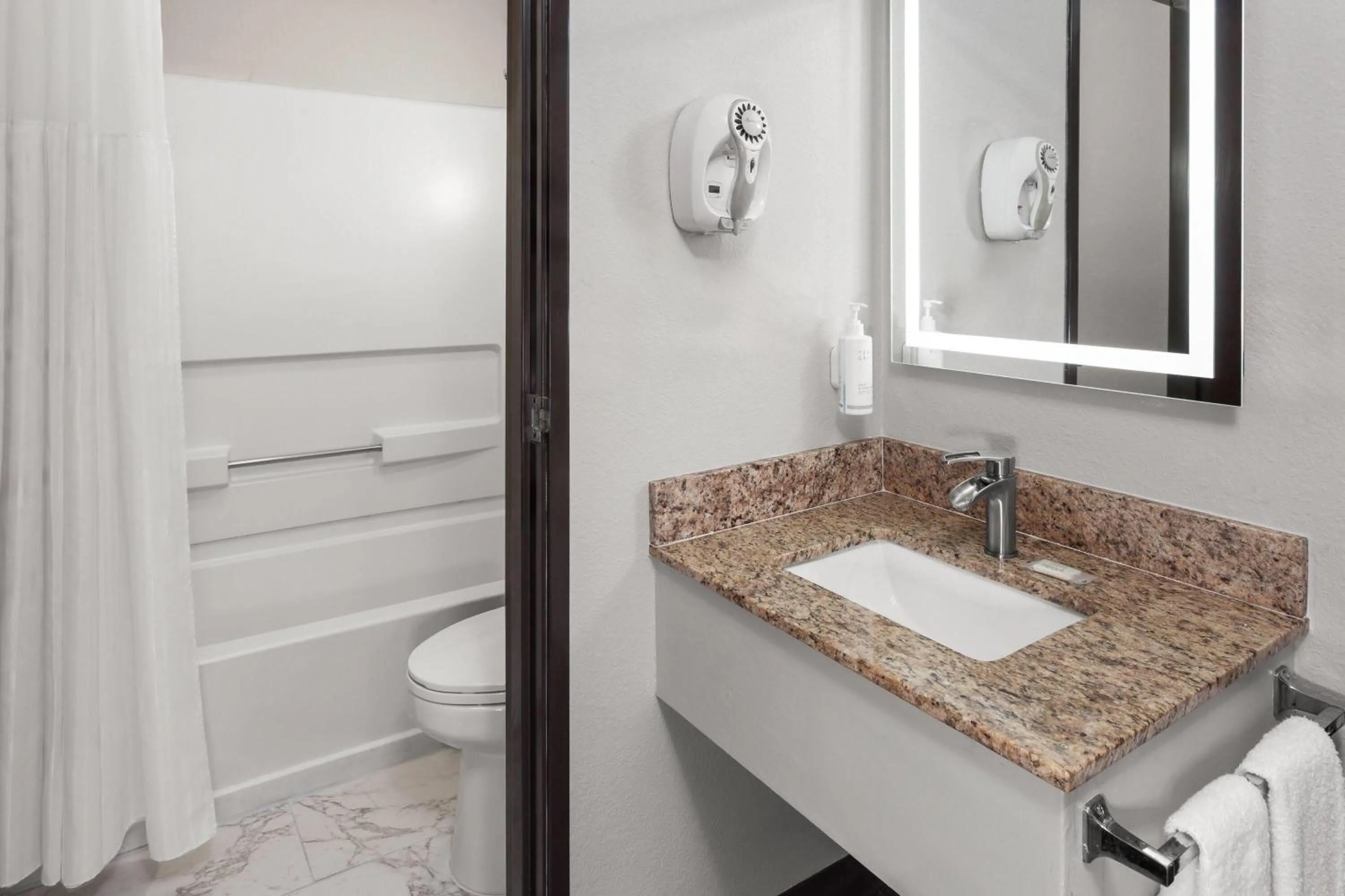 Bathroom in Days Inn & Suites by Wyndham Kaukauna WI