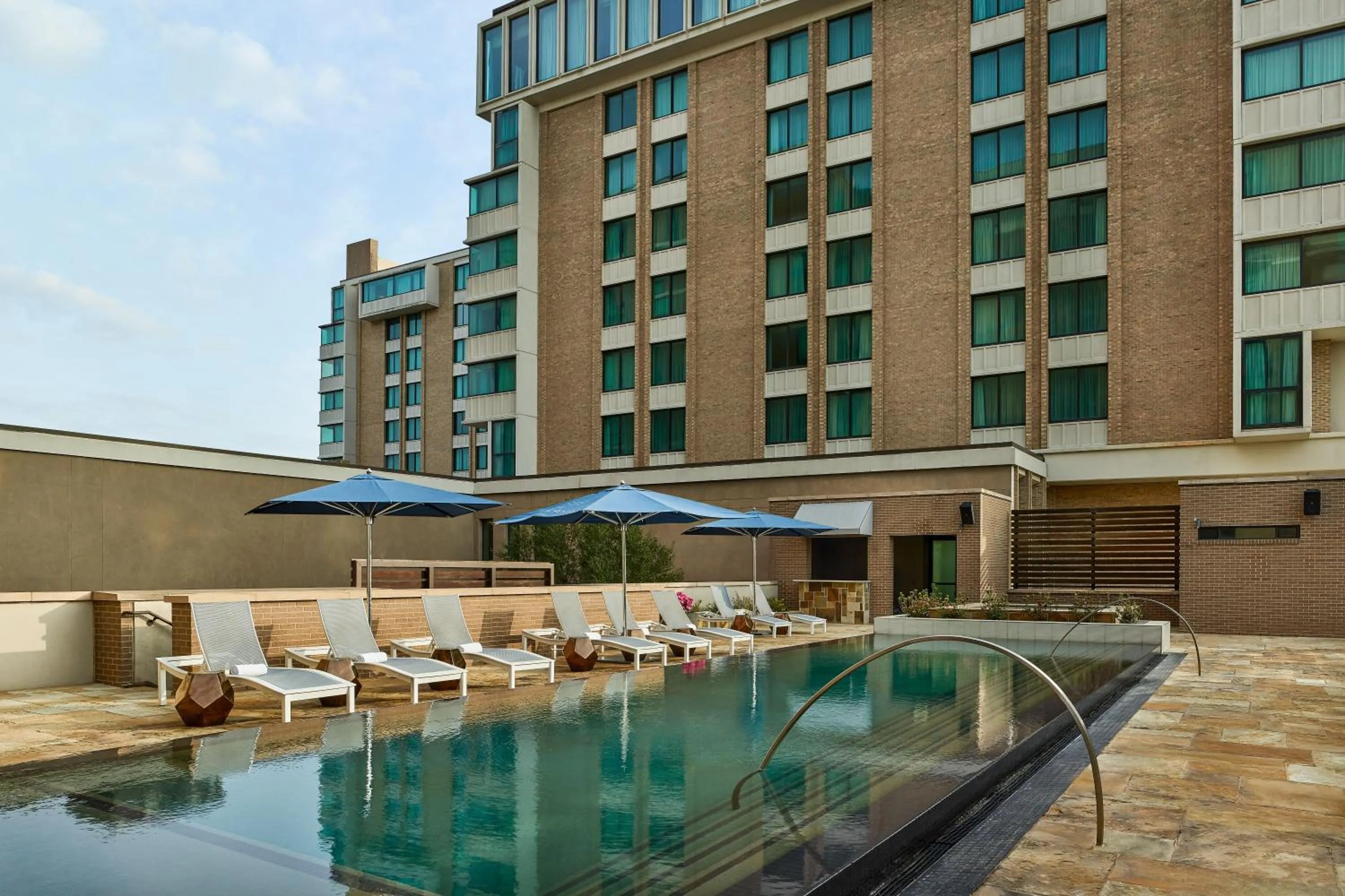 Swimming pool in The Highland Dallas, Curio Collection by Hilton