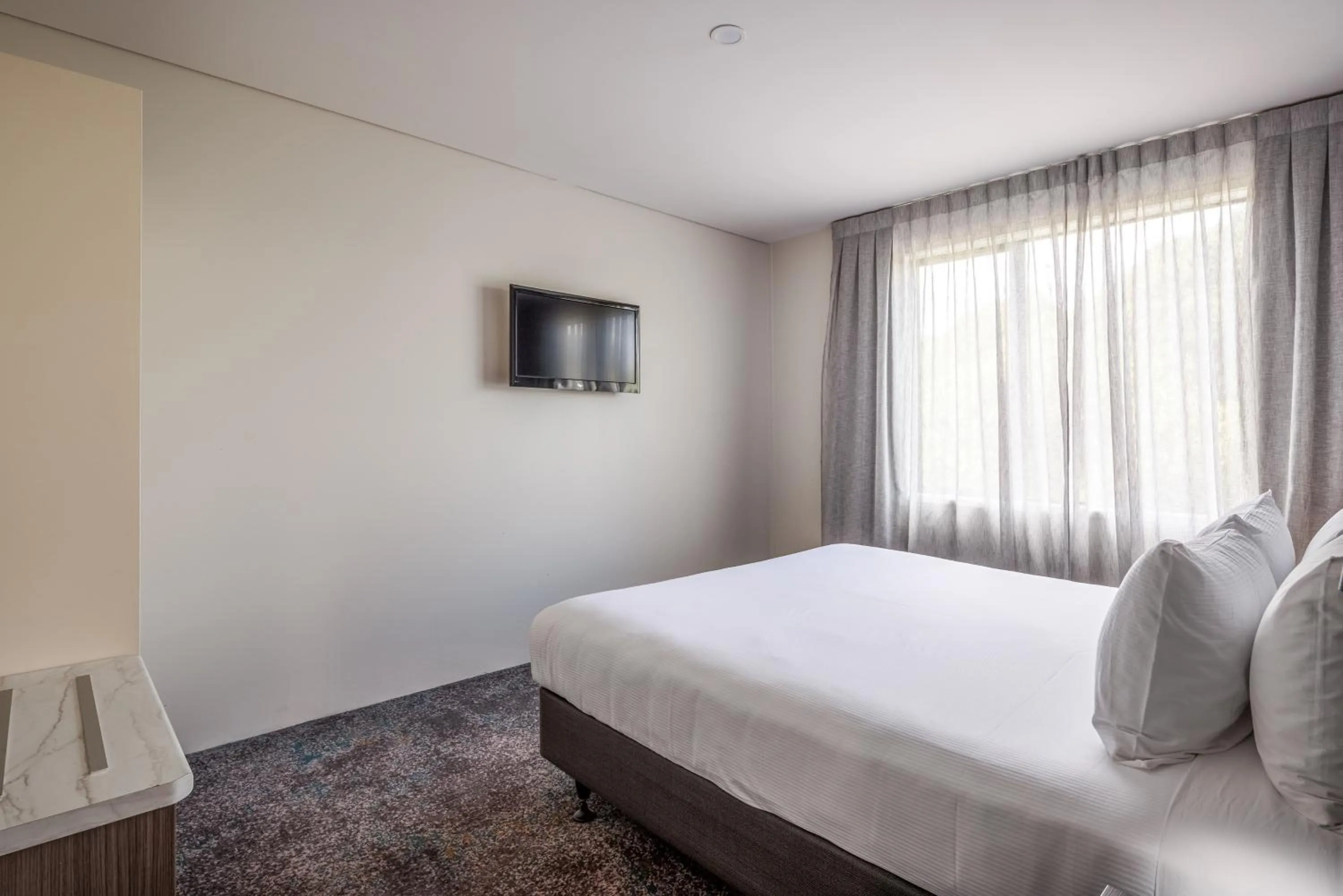 Bed in Heartland Hotel Auckland Airport