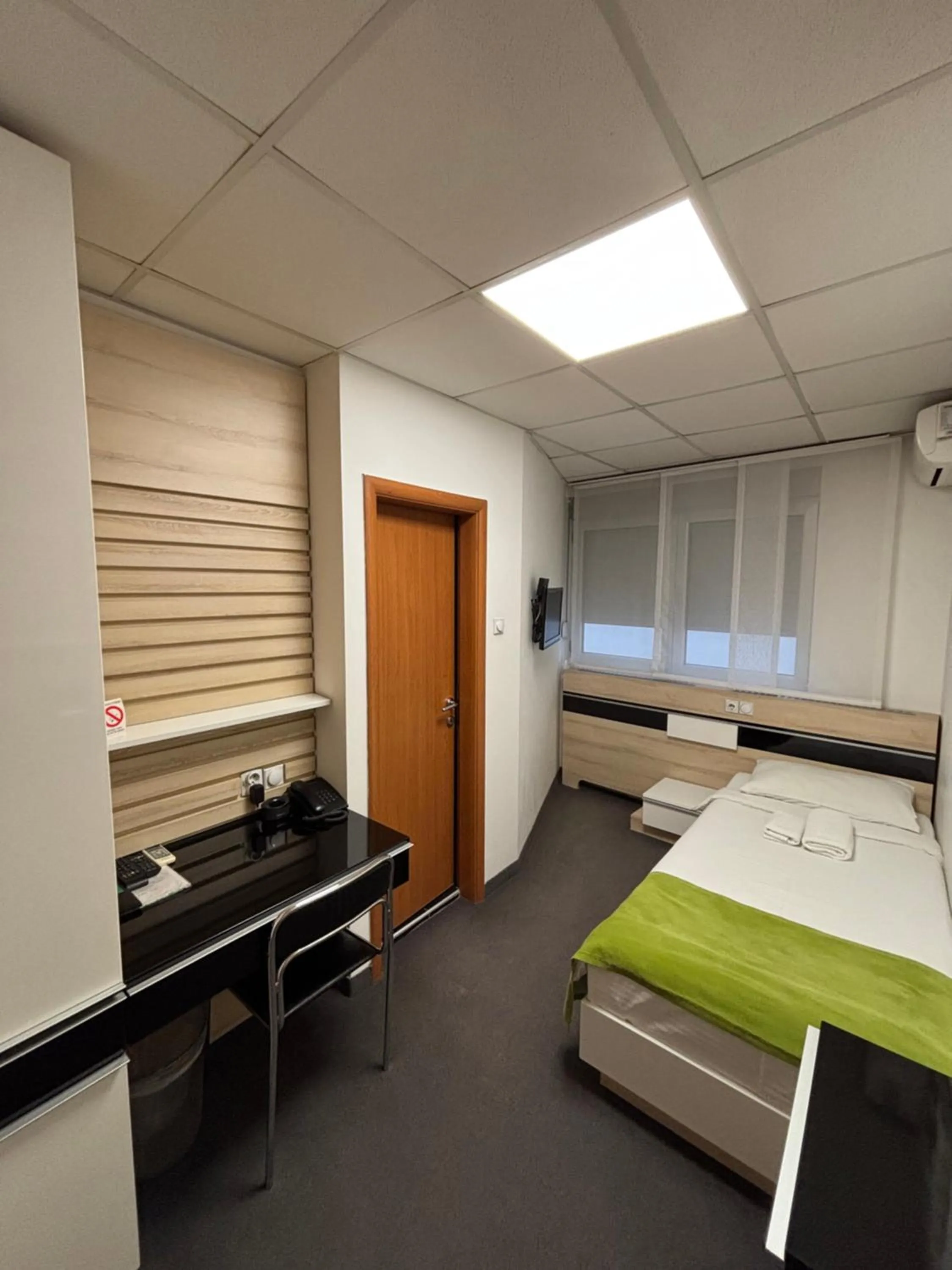 Bed in Garni Hotel Consul