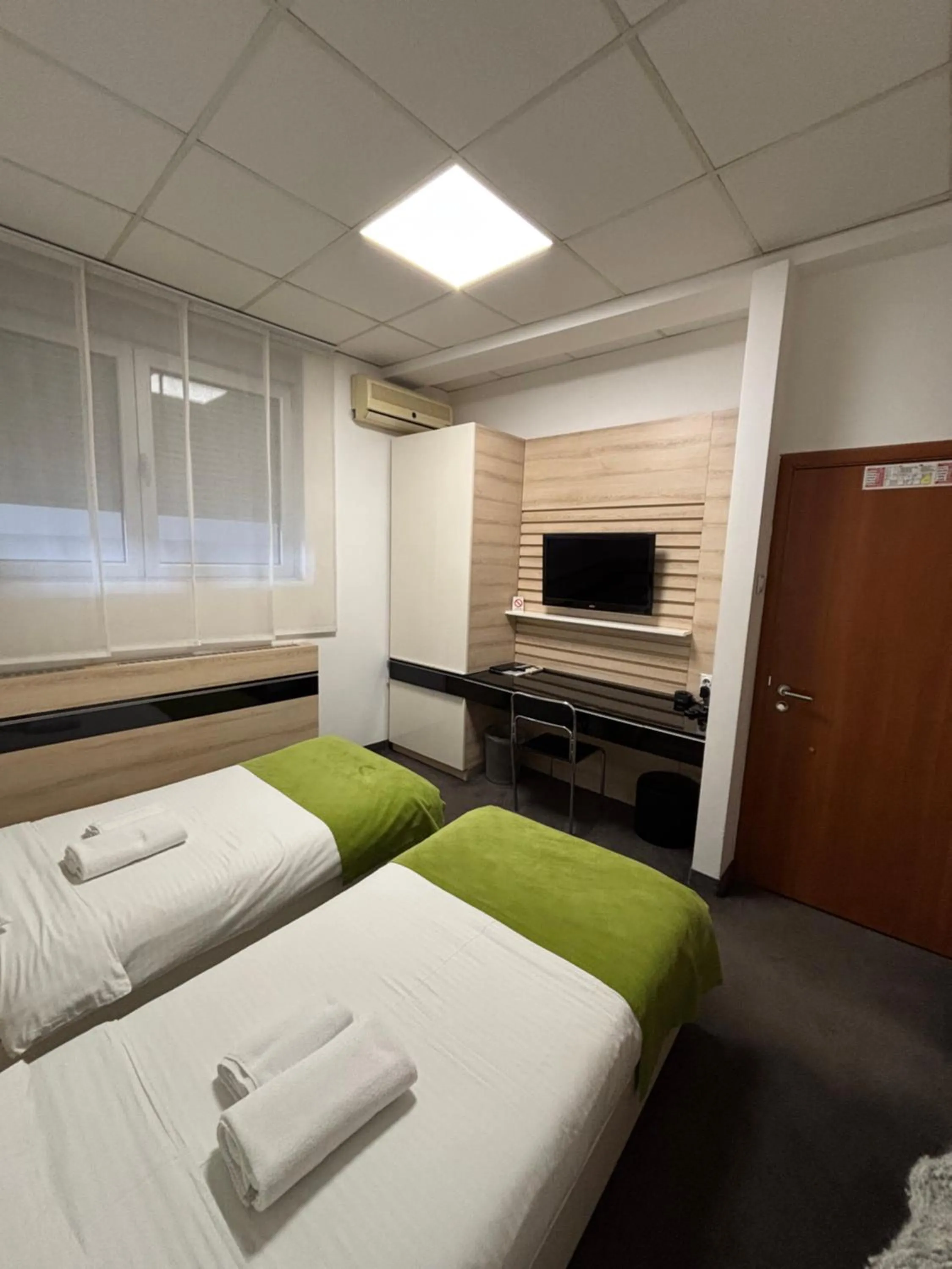 Bed in Garni Hotel Consul