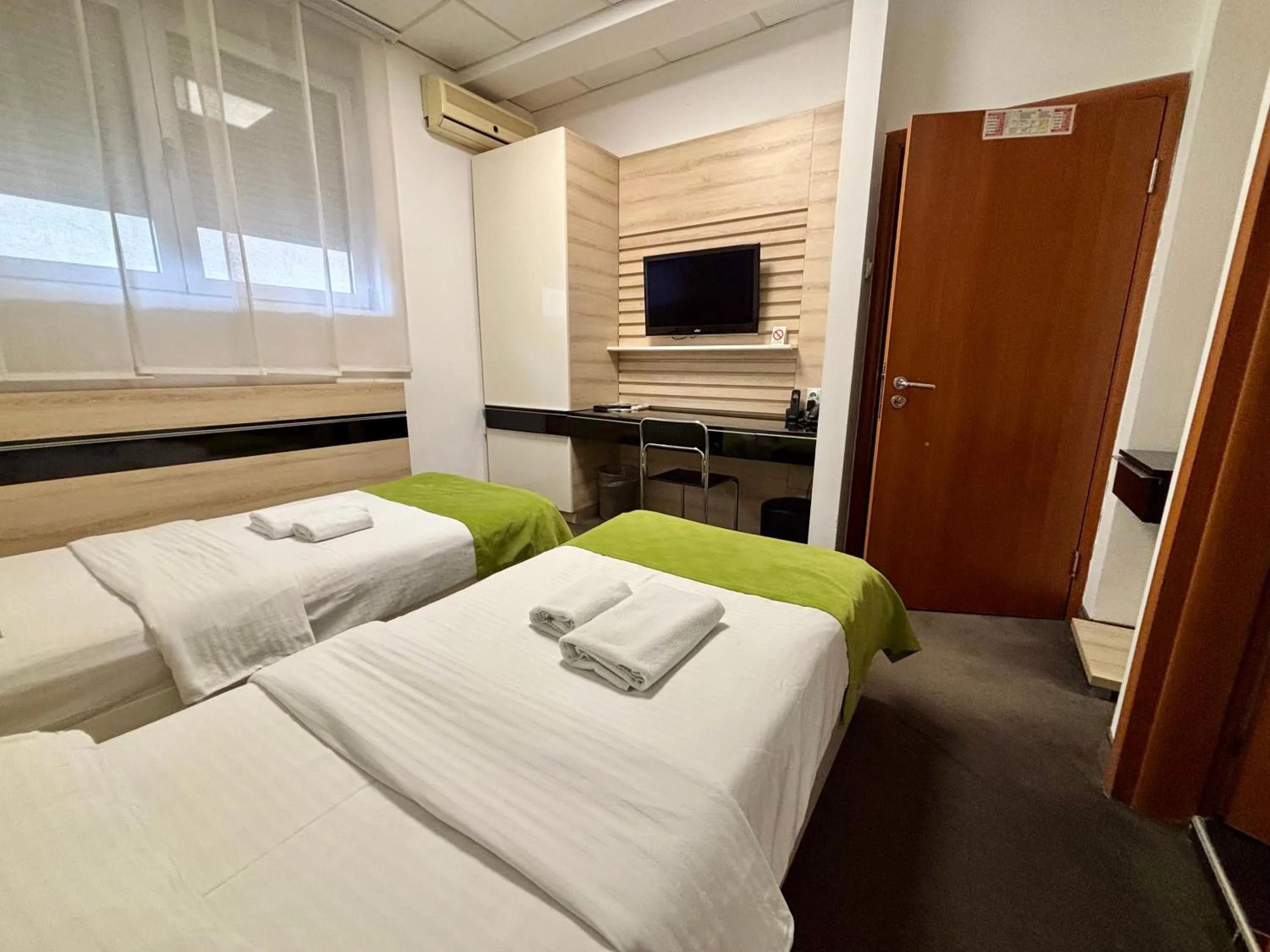 Bed in Garni Hotel Consul