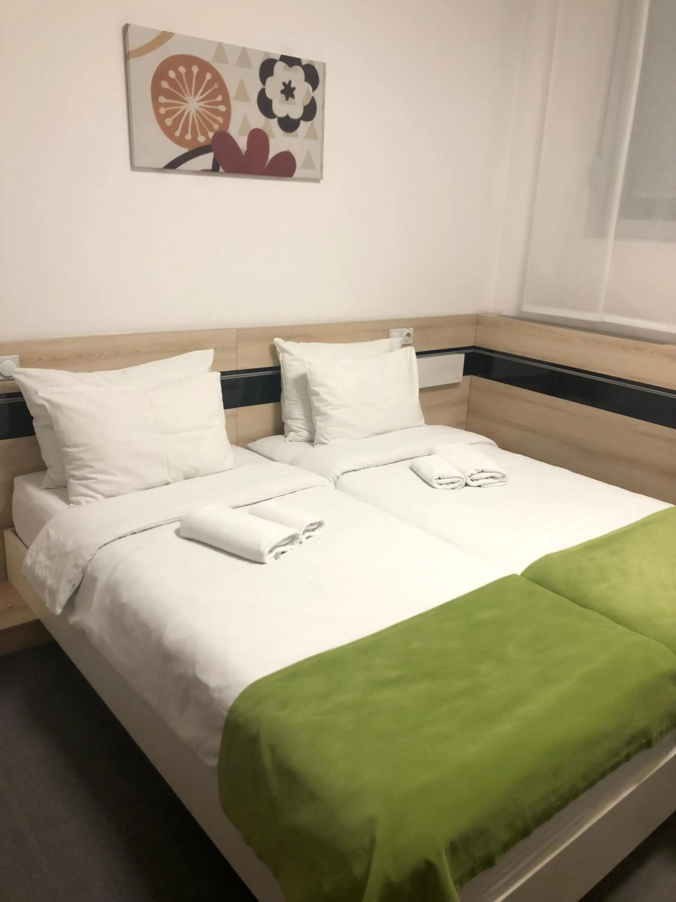 Bed in Garni Hotel Consul