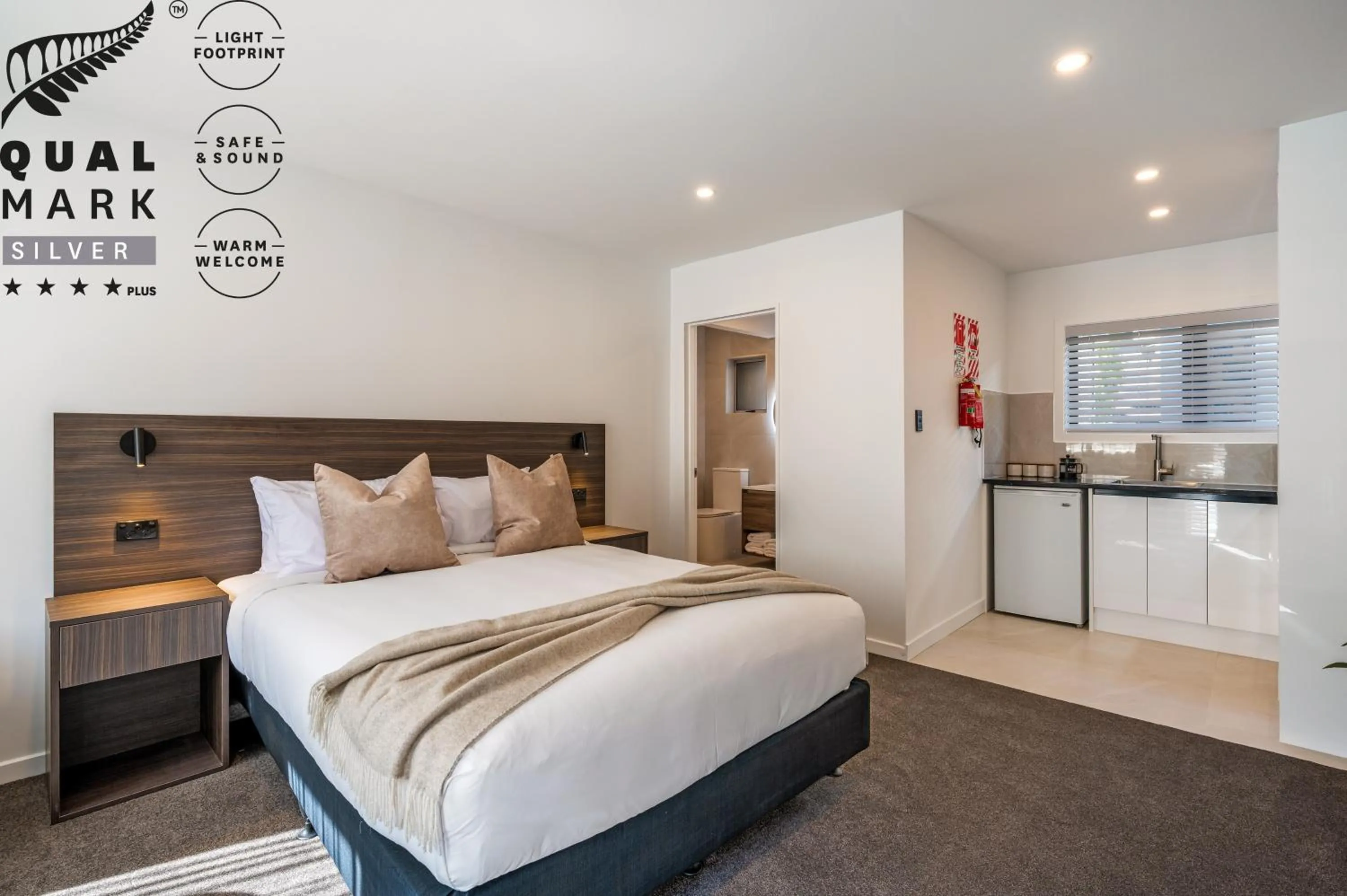 Bed in Luxe Suites & Apartments