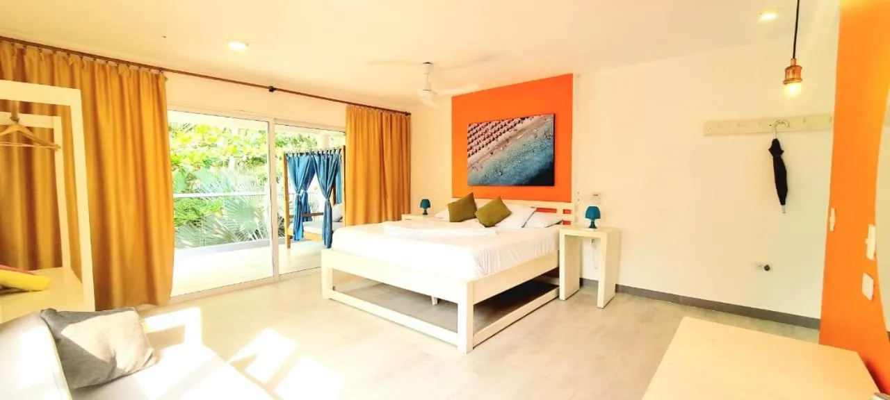 Bed in Blue Mango Beach Hotel