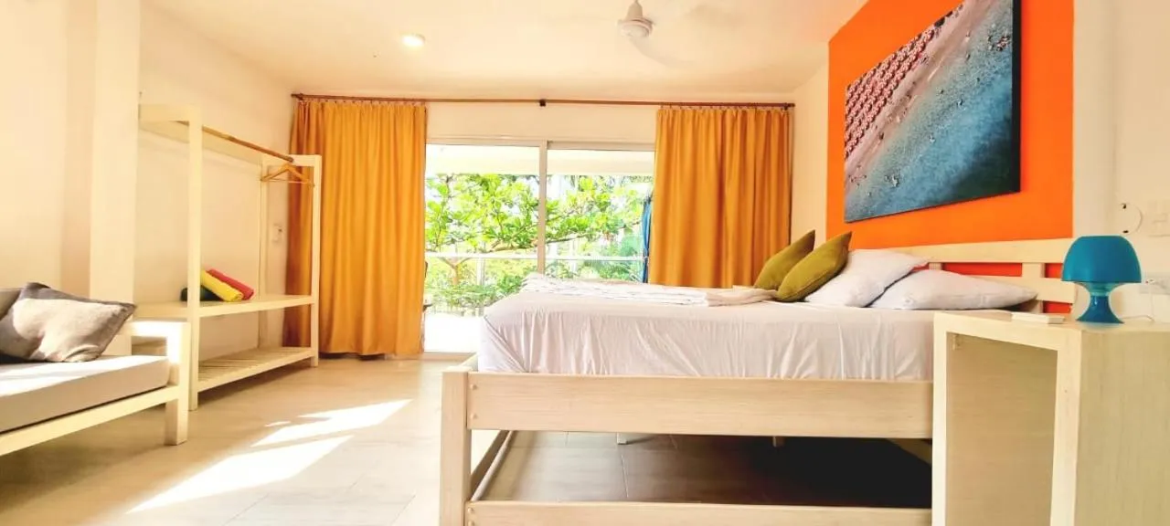 Bed in Blue Mango Beach Hotel