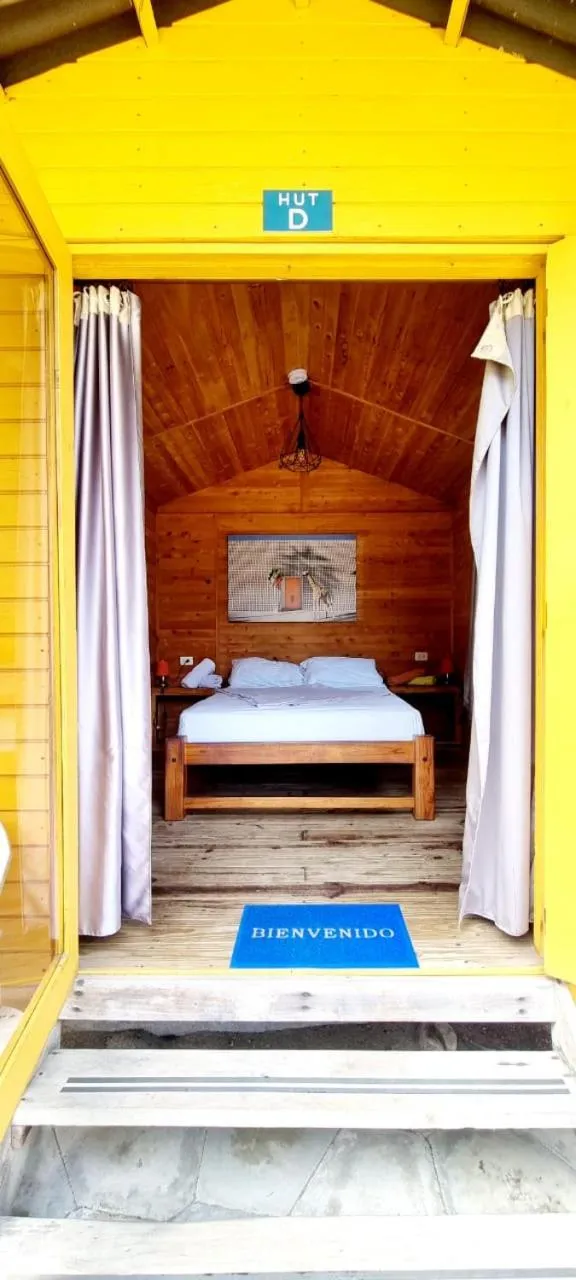 Bed in Blue Mango Beach Hotel