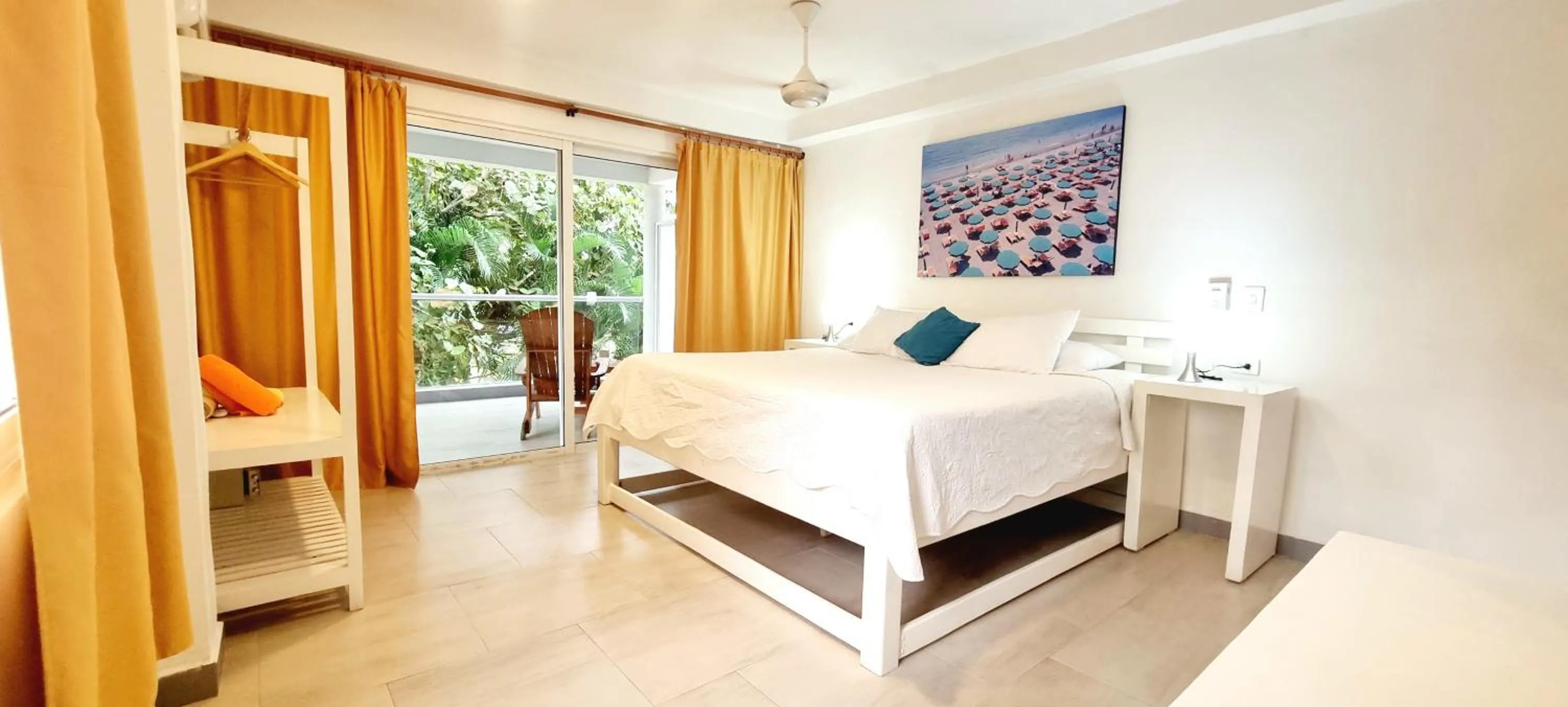 Bed in Blue Mango Beach Hotel