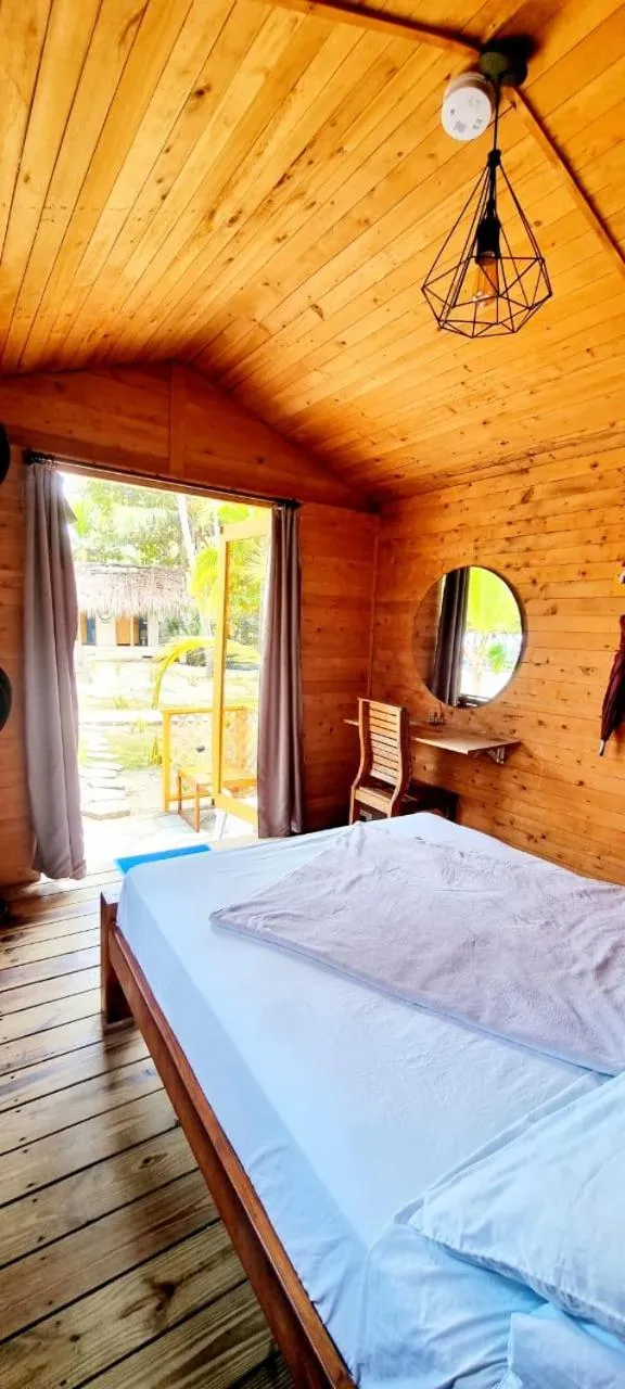 Bed in Blue Mango Beach Hotel