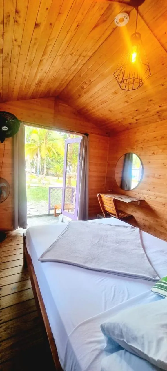 Bed in Blue Mango Beach Hotel