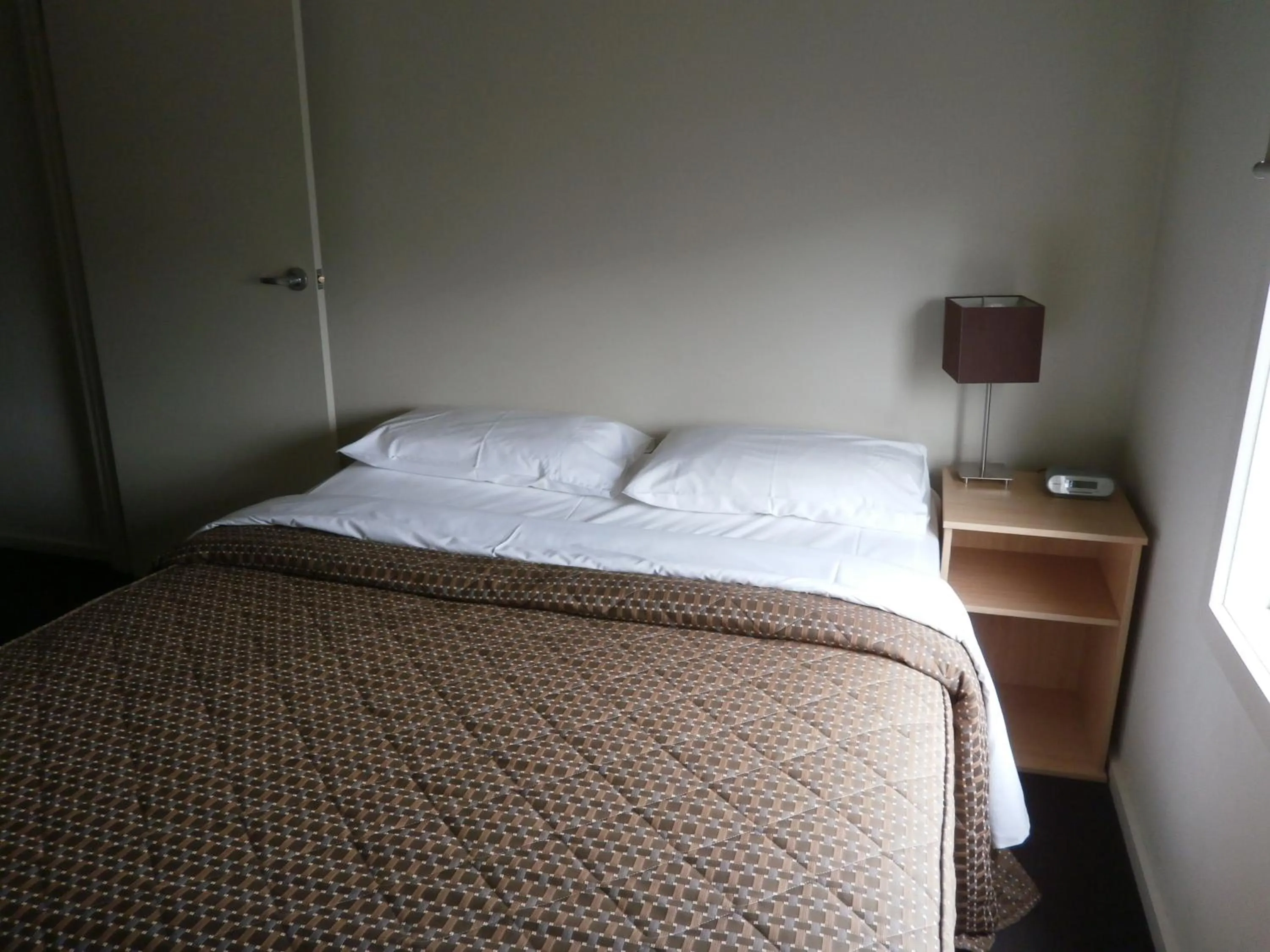 Bed in Sovereign Views Apartments