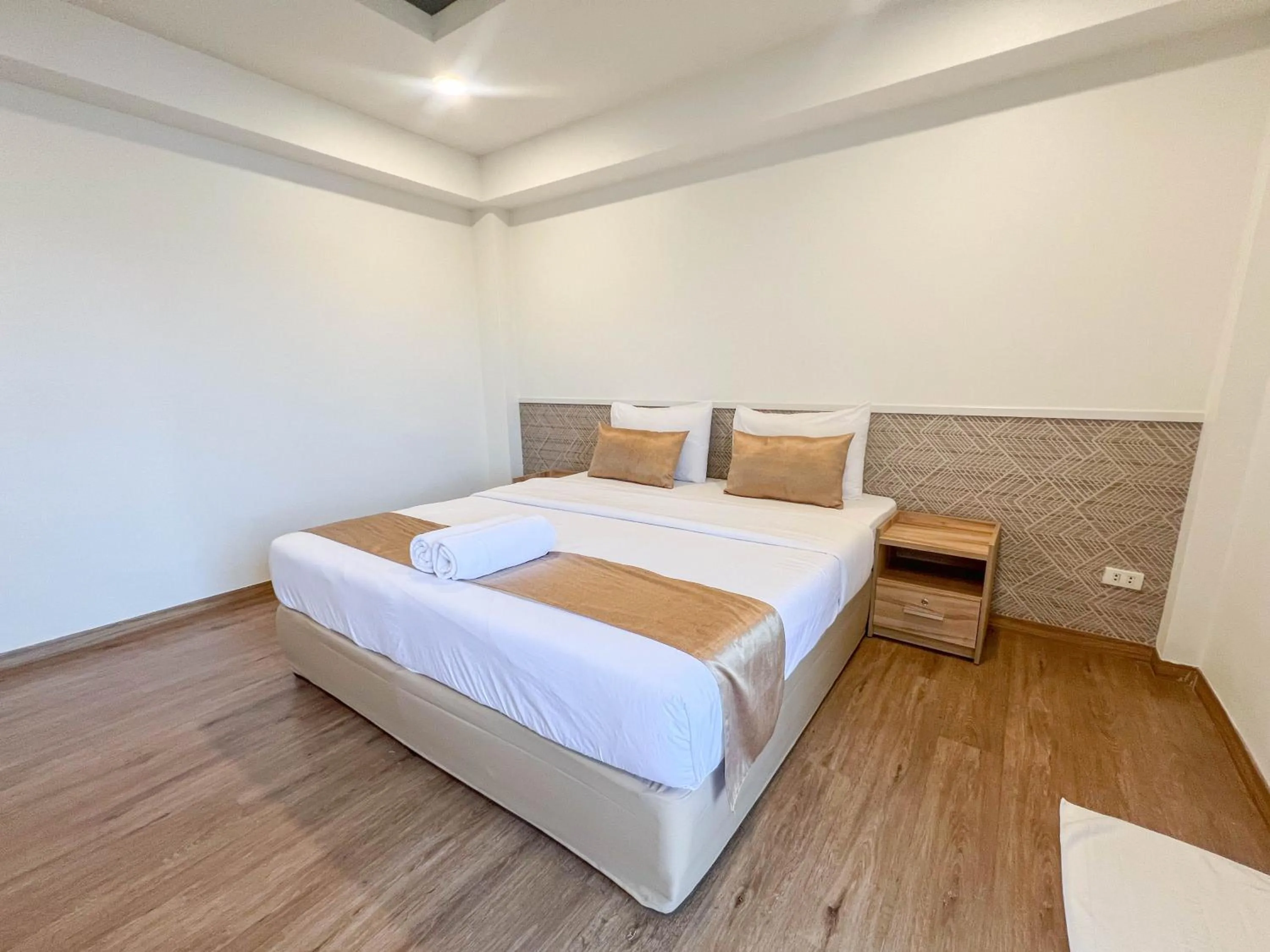 Bed in Inspire House Hotel