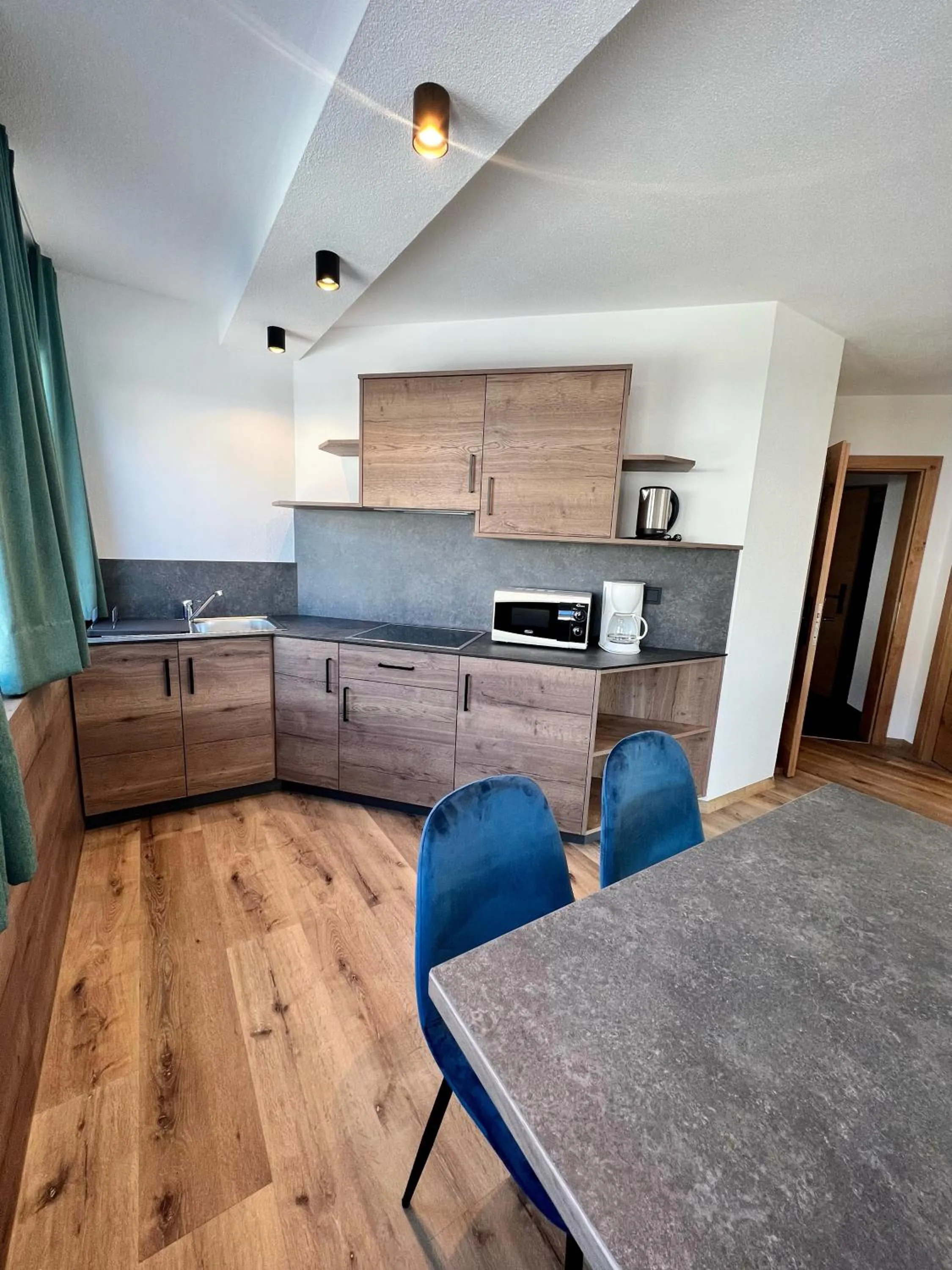 Kitchen or kitchenette in Schmalzlhof Hotel & Apartments