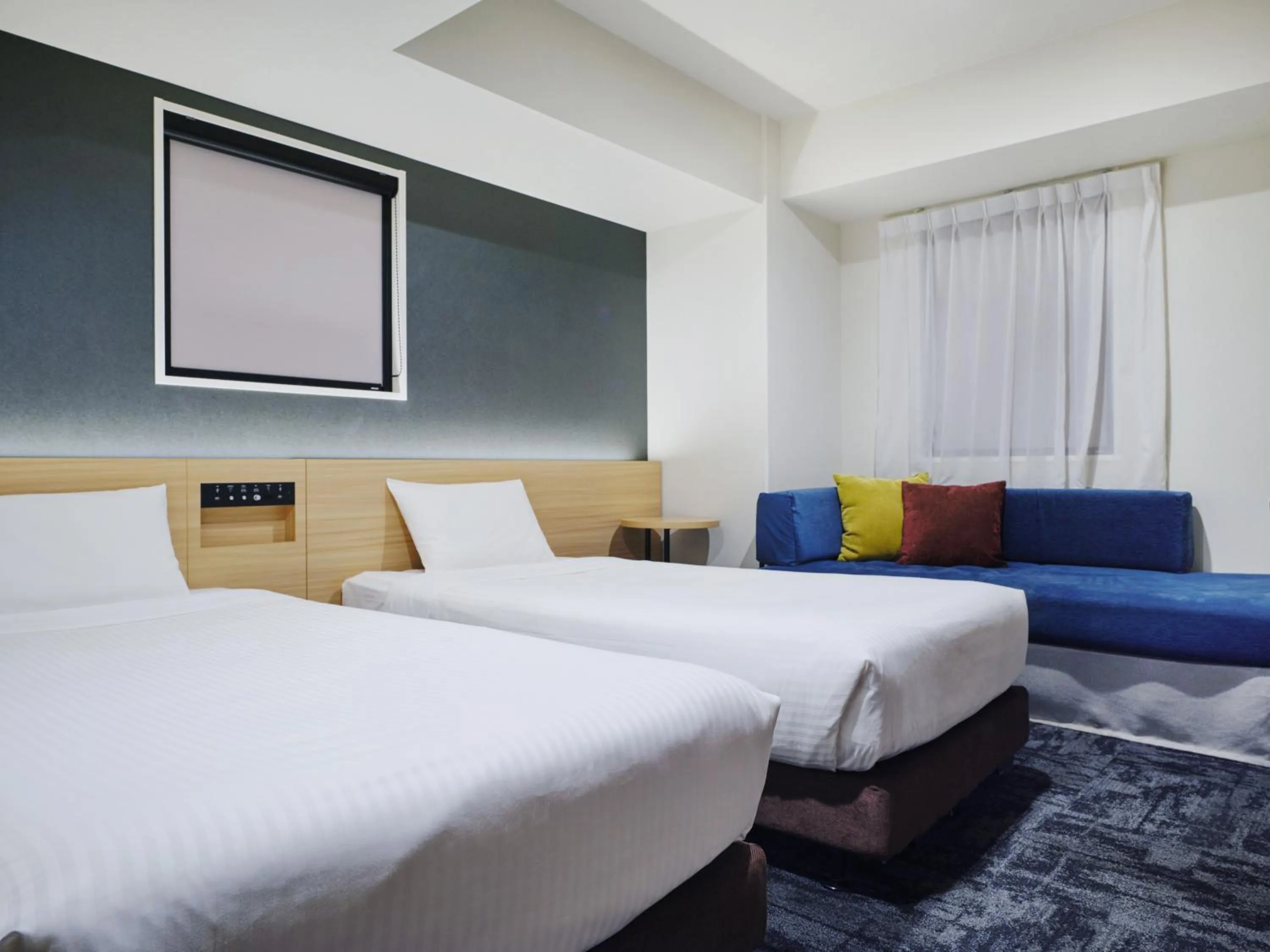 Bed in hotel MONday Tokyo Nishikasai