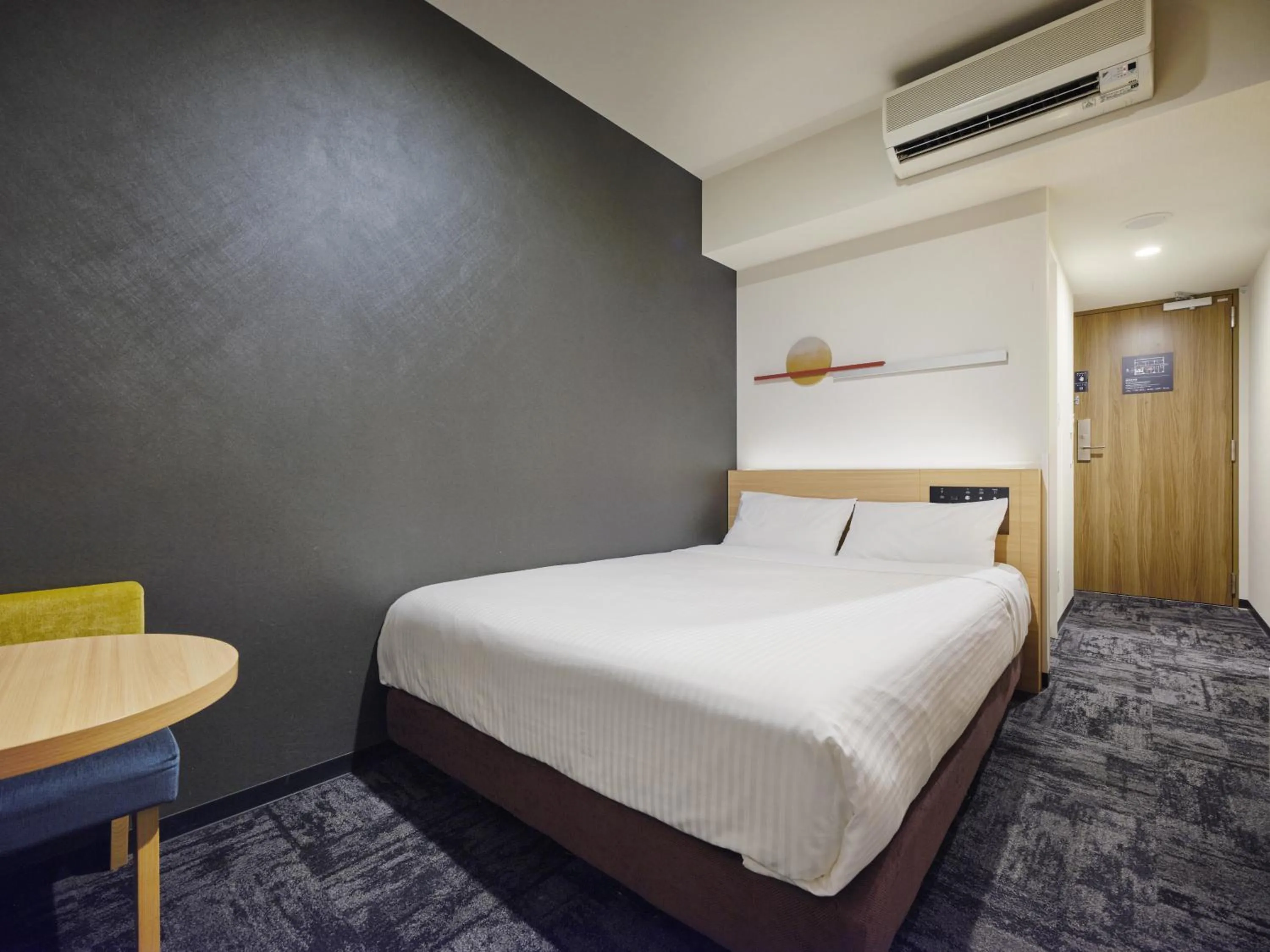 Bed in hotel MONday Tokyo Nishikasai