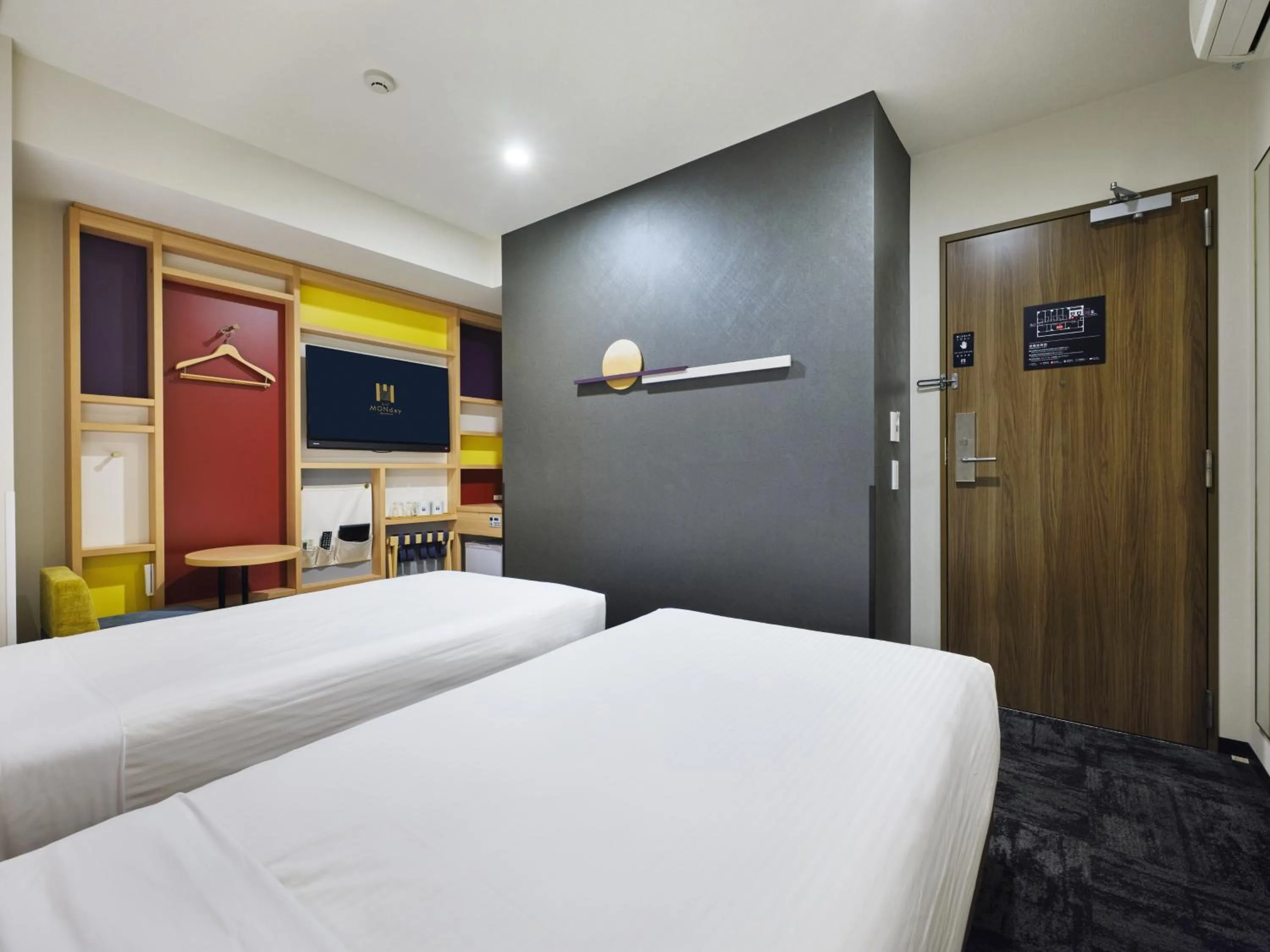 Bed in hotel MONday Tokyo Nishikasai