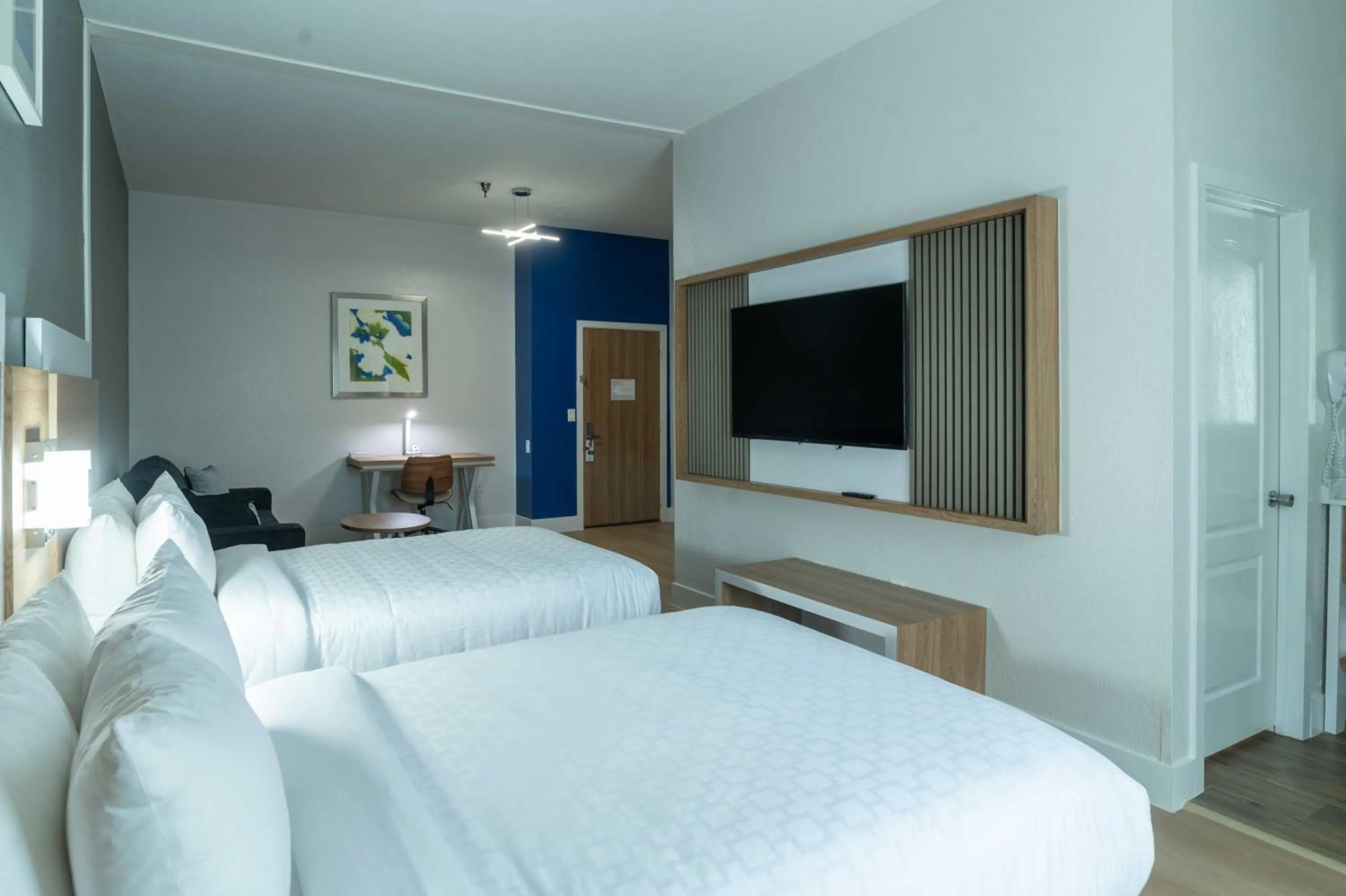 Bed in Clarion Inn & Suites Central Clearwater Beach