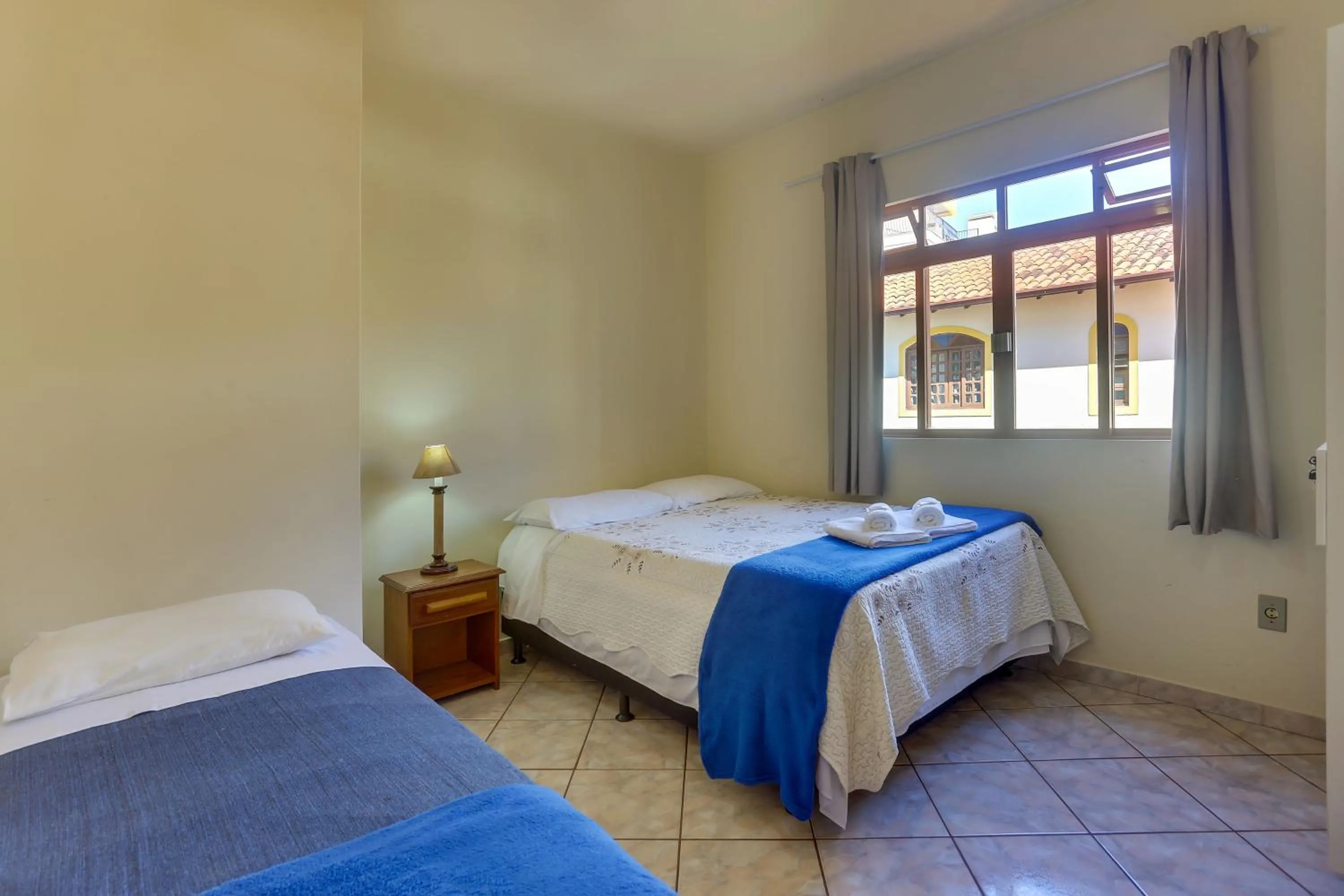 Bed in Pousada Carolina