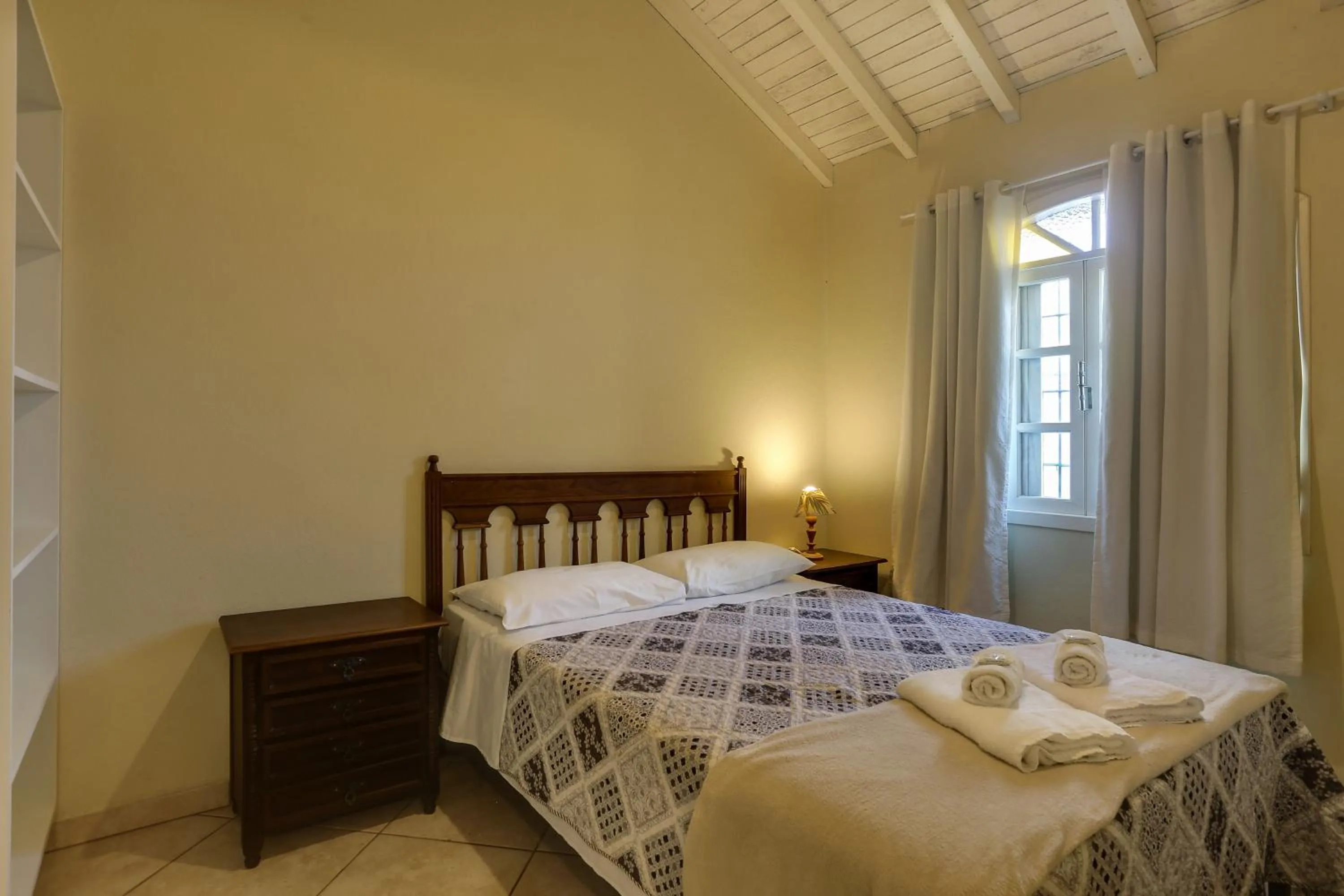 Bed in Pousada Carolina