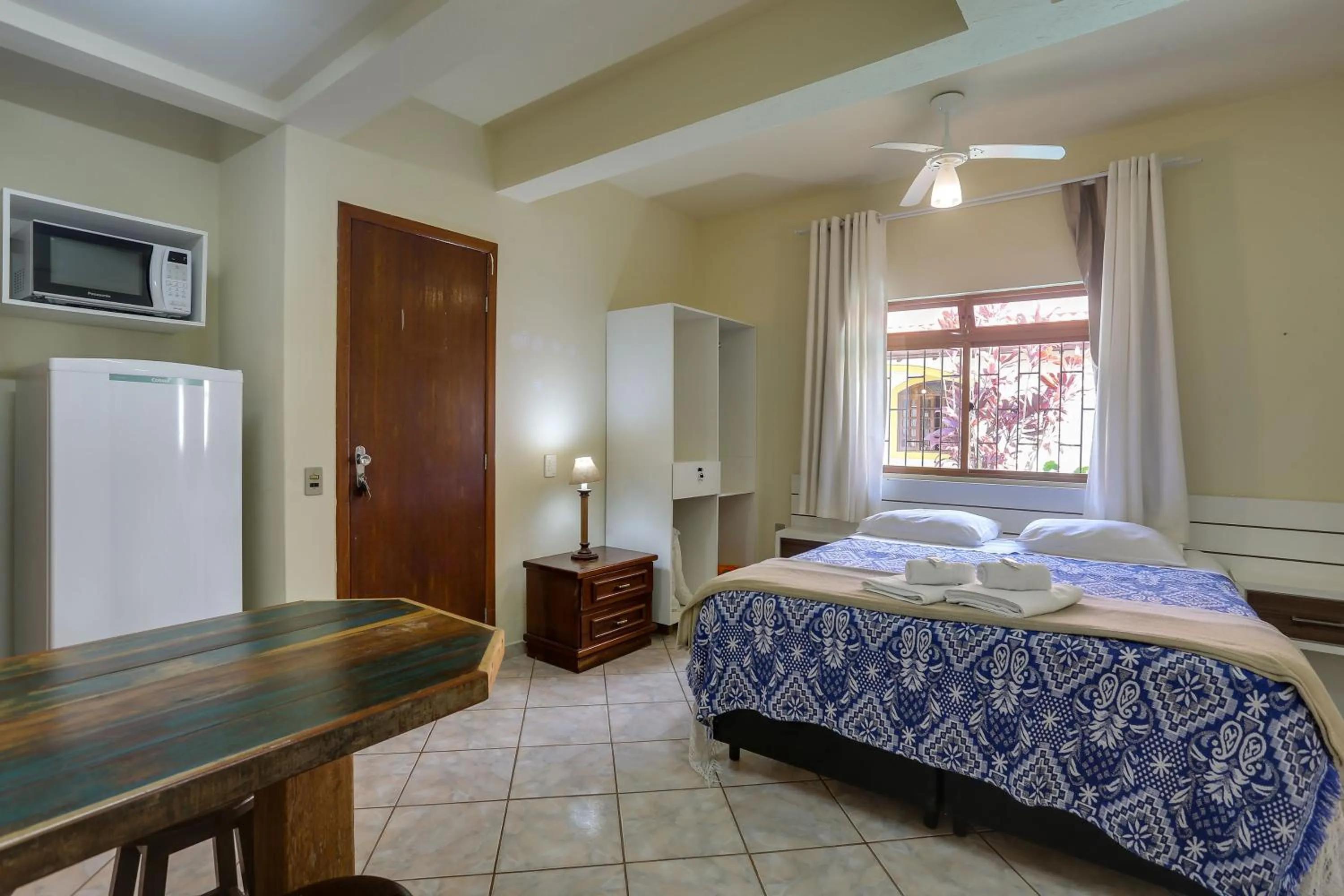 Bed in Pousada Carolina