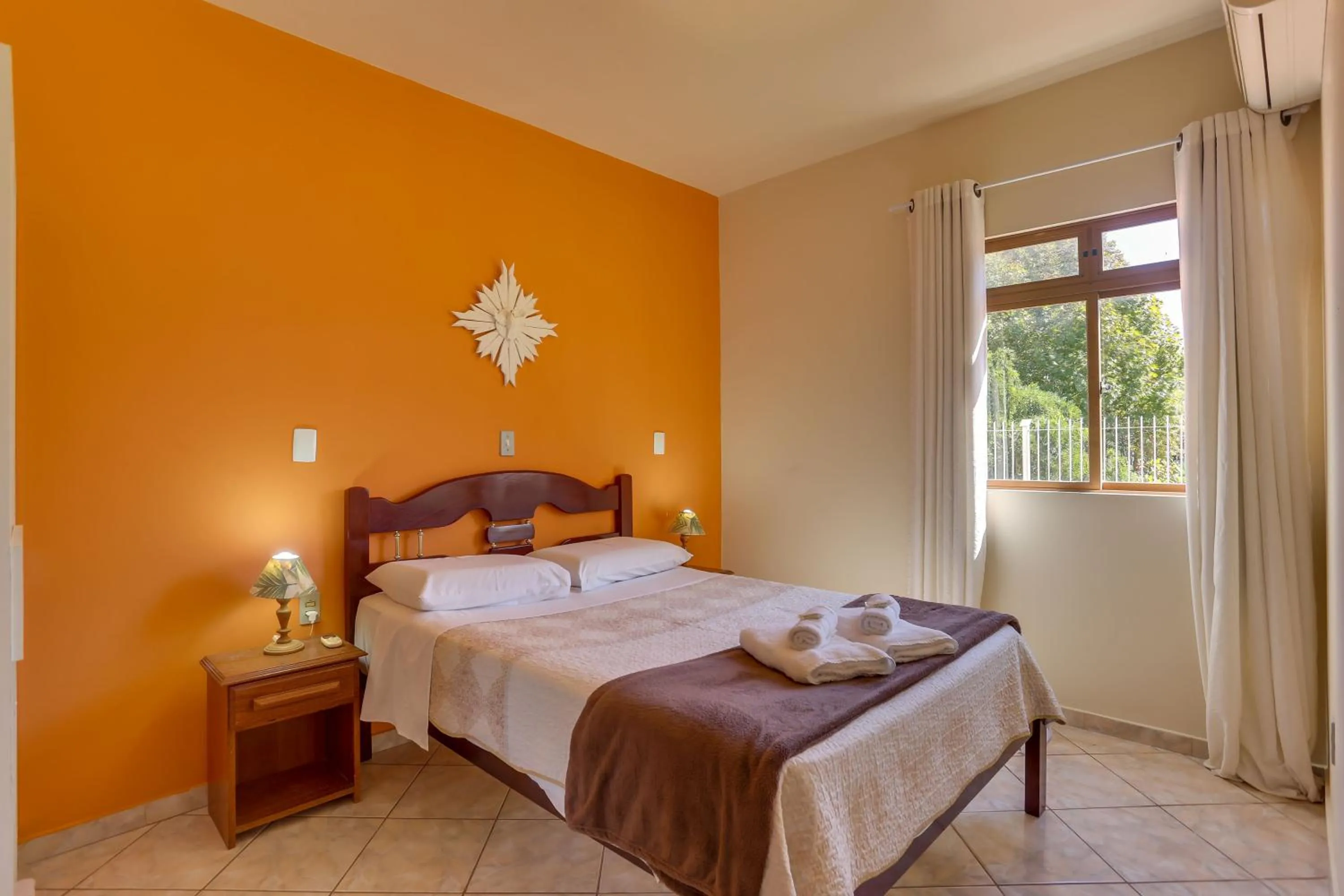 Bed in Pousada Carolina