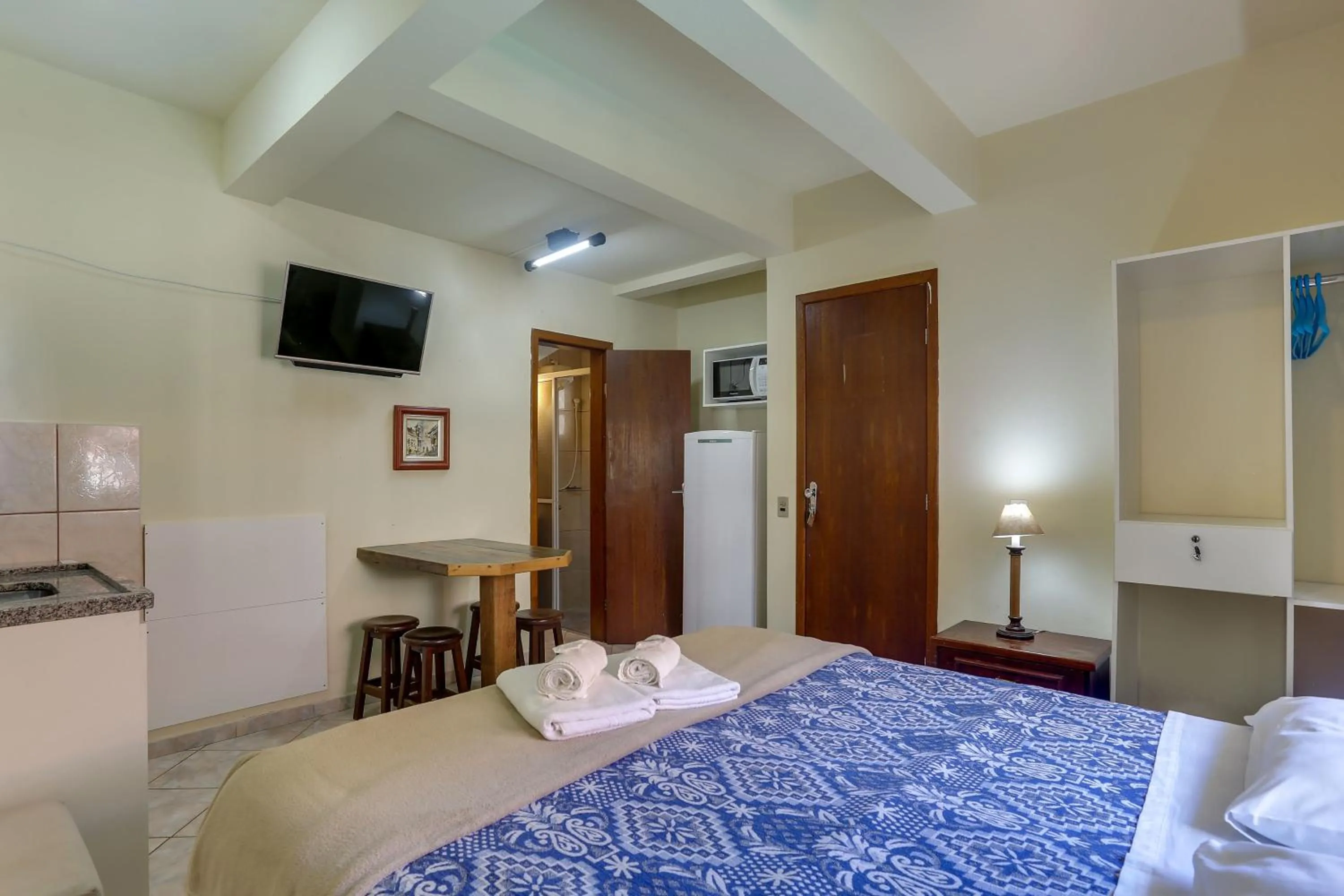 Bed in Pousada Carolina