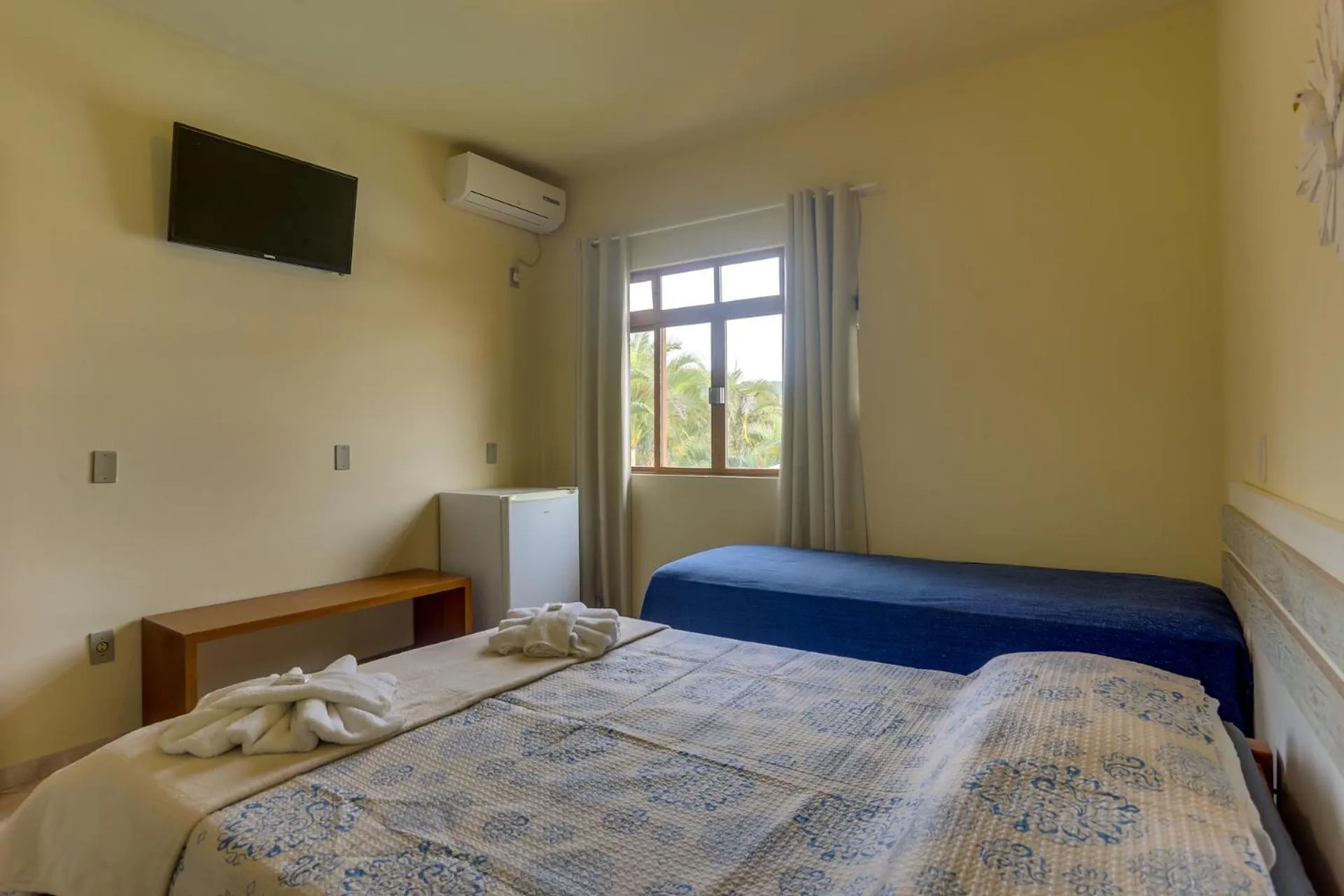 Bed in Pousada Carolina