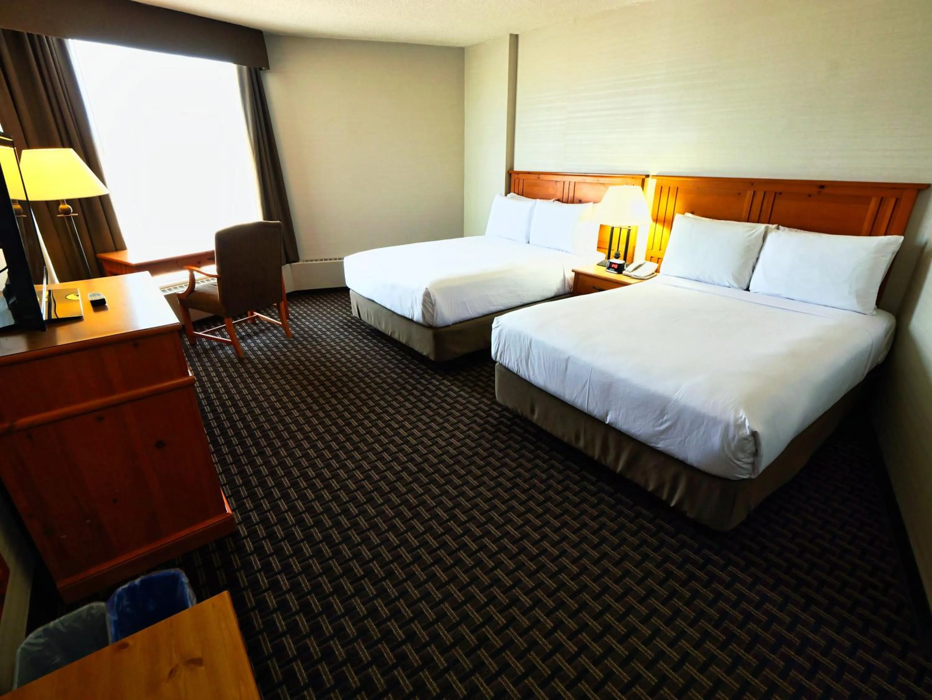 Bed in Continental Inn & Suites