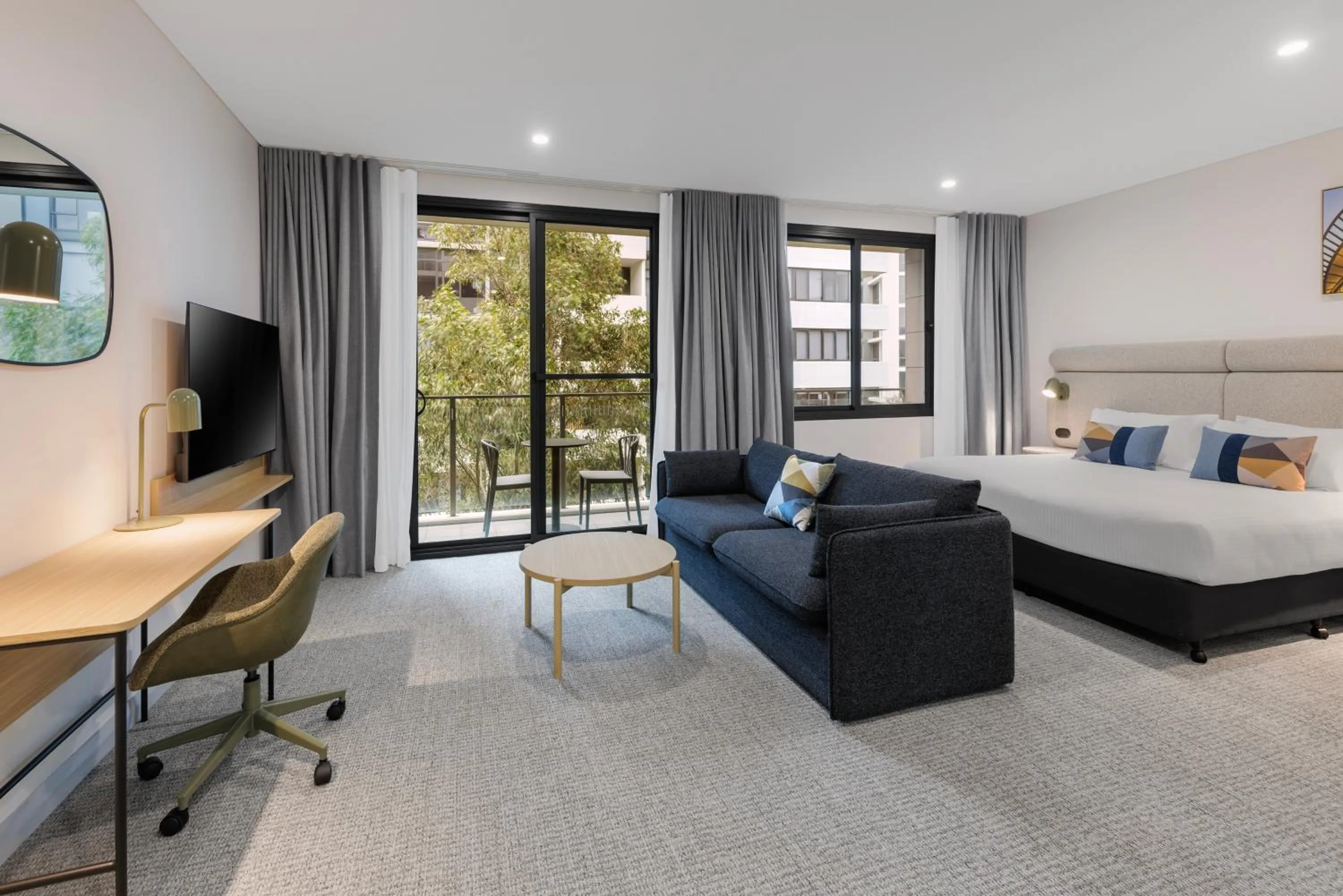 Living room, Bed in Quest at Sydney Olympic Park