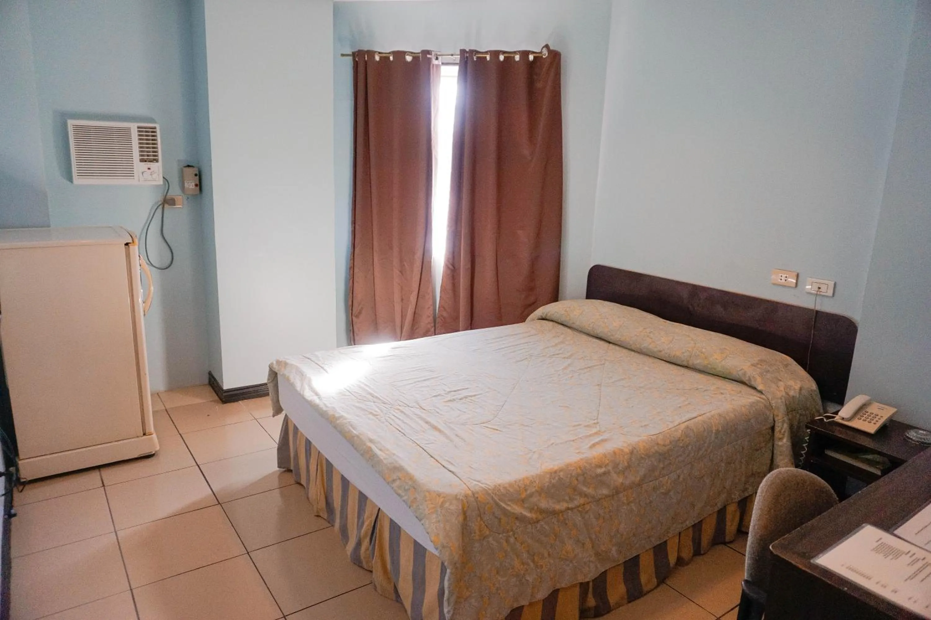 Bed in Crowne Garden Hotel