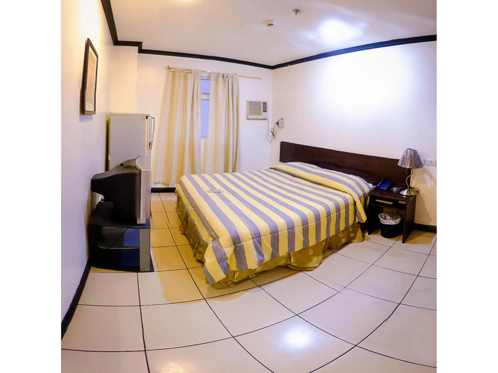 Bed in Crowne Garden Hotel