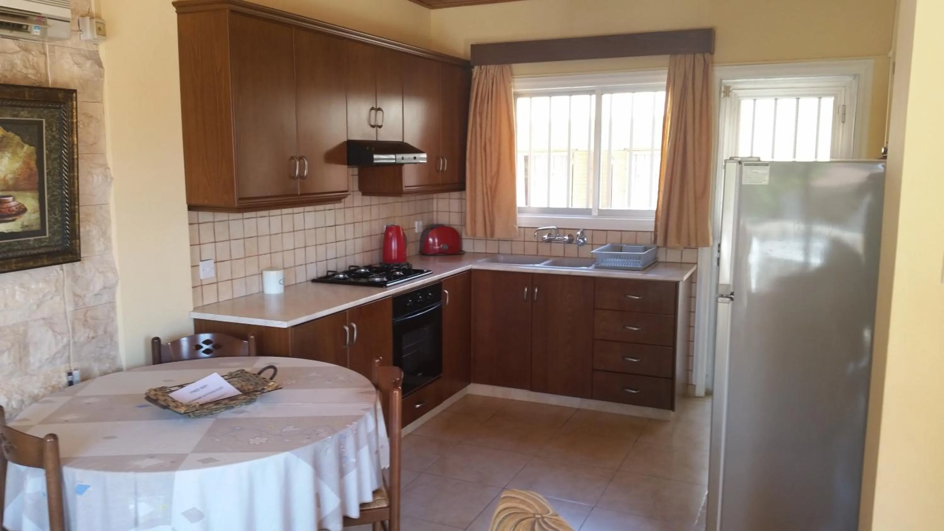 Kitchen or kitchenette in Kotzias Beach Apartments