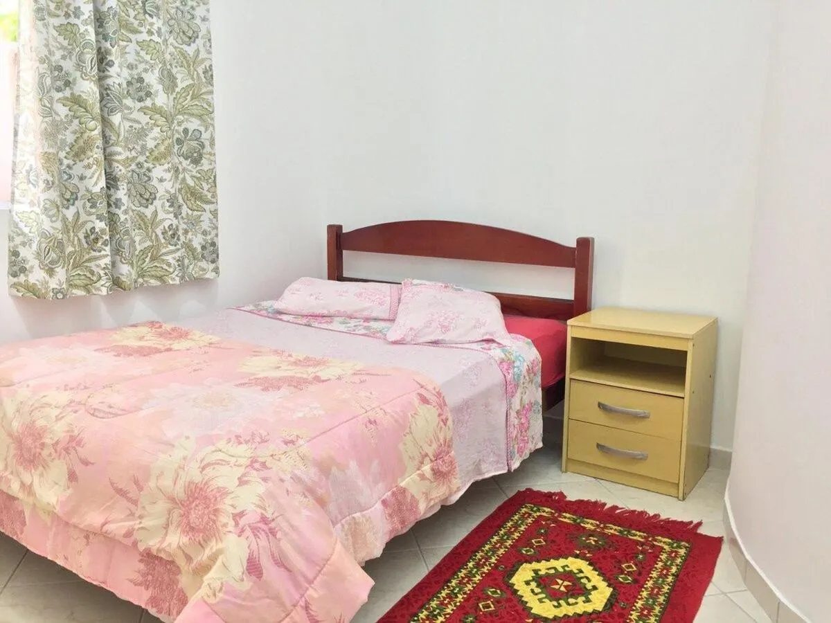 Bed in Pousada Souza