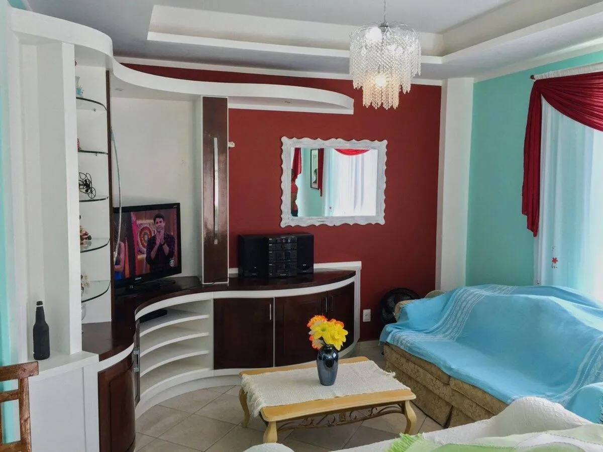 Living room, Bed in Pousada Souza