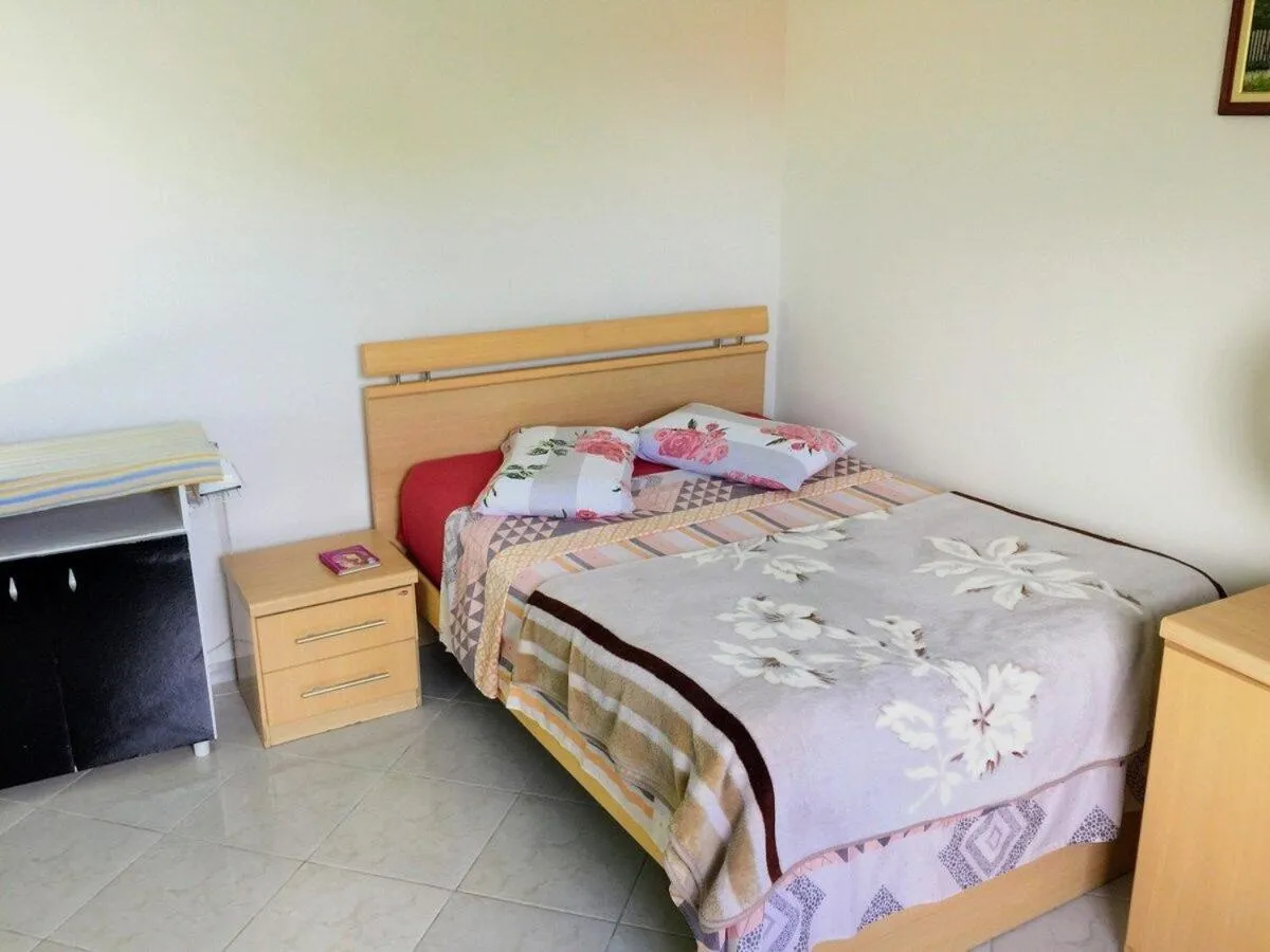 Bed in Pousada Souza