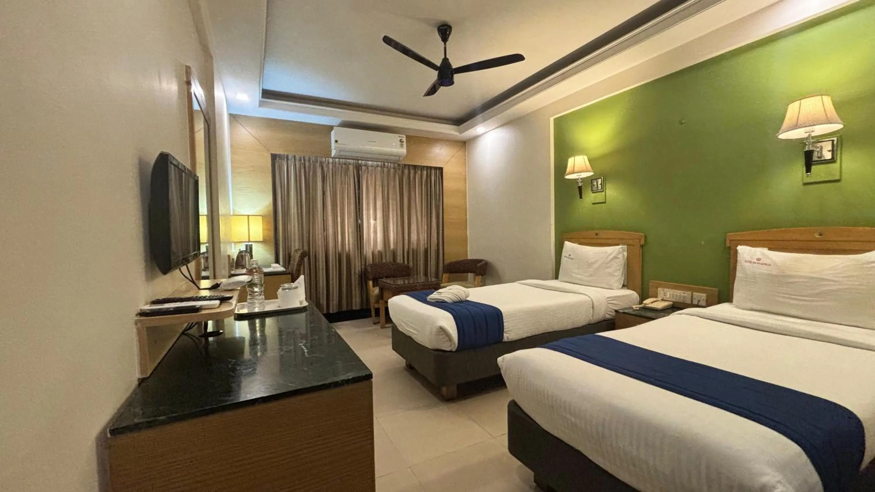 Photo of the whole room, Bed in Hotel Dr Rajkumar International