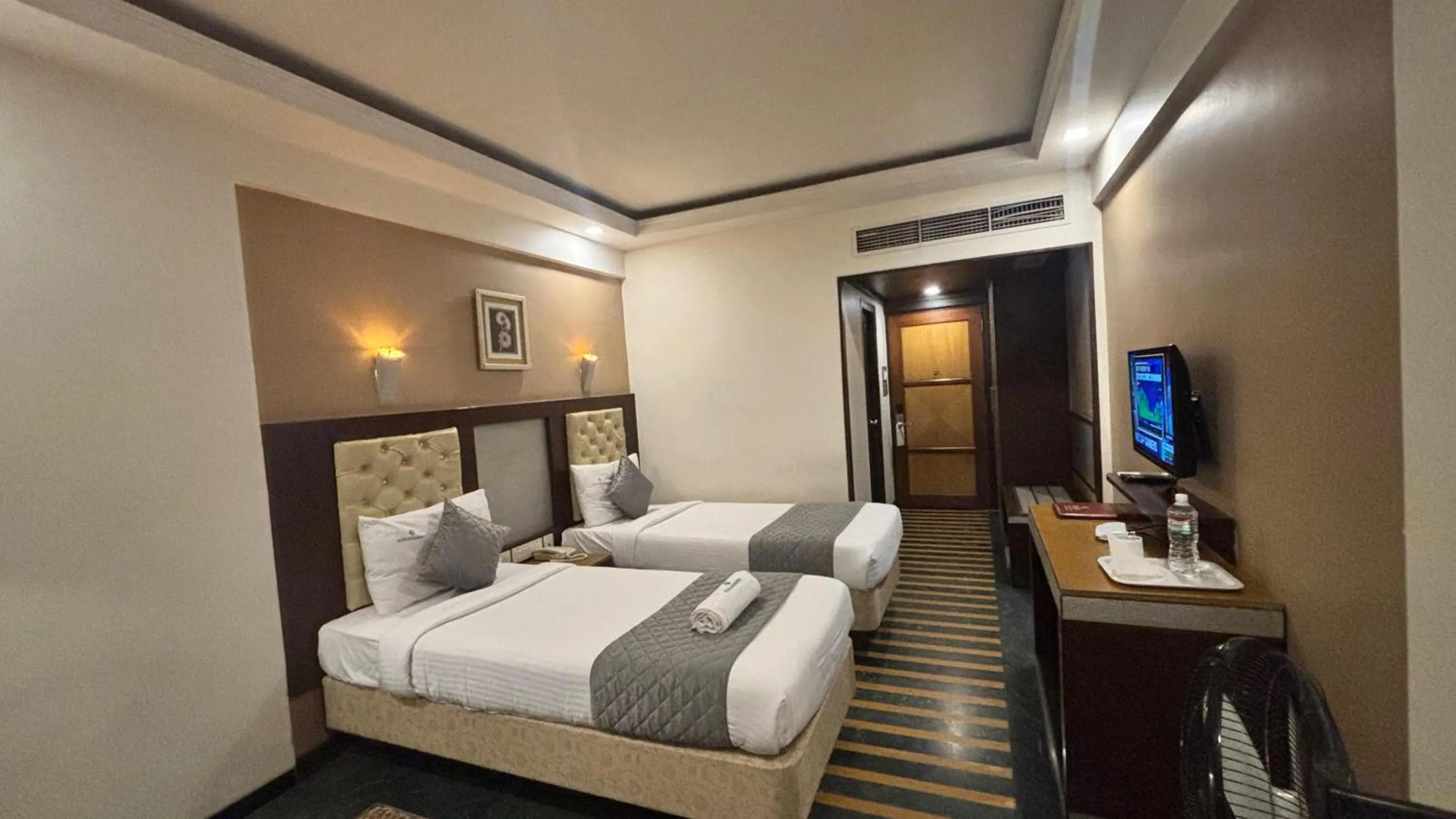 Bed in Hotel Dr Rajkumar International