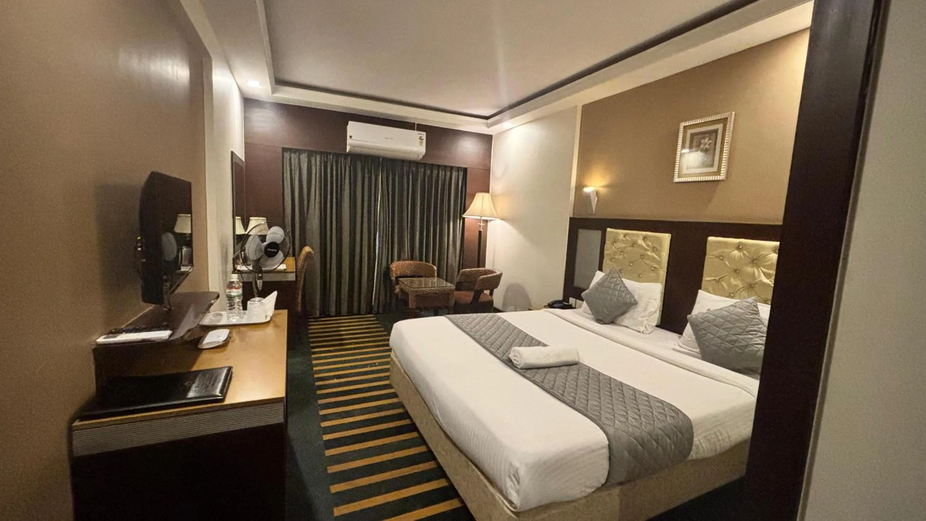 Bed in Hotel Dr Rajkumar International