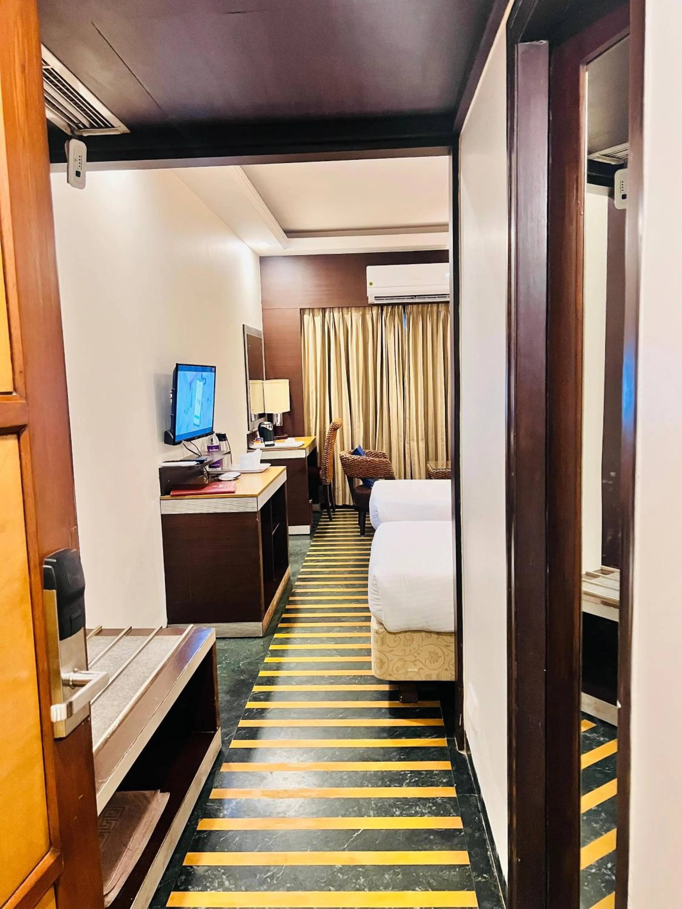 Communal lounge/ TV room, Bed in Hotel Dr Rajkumar International