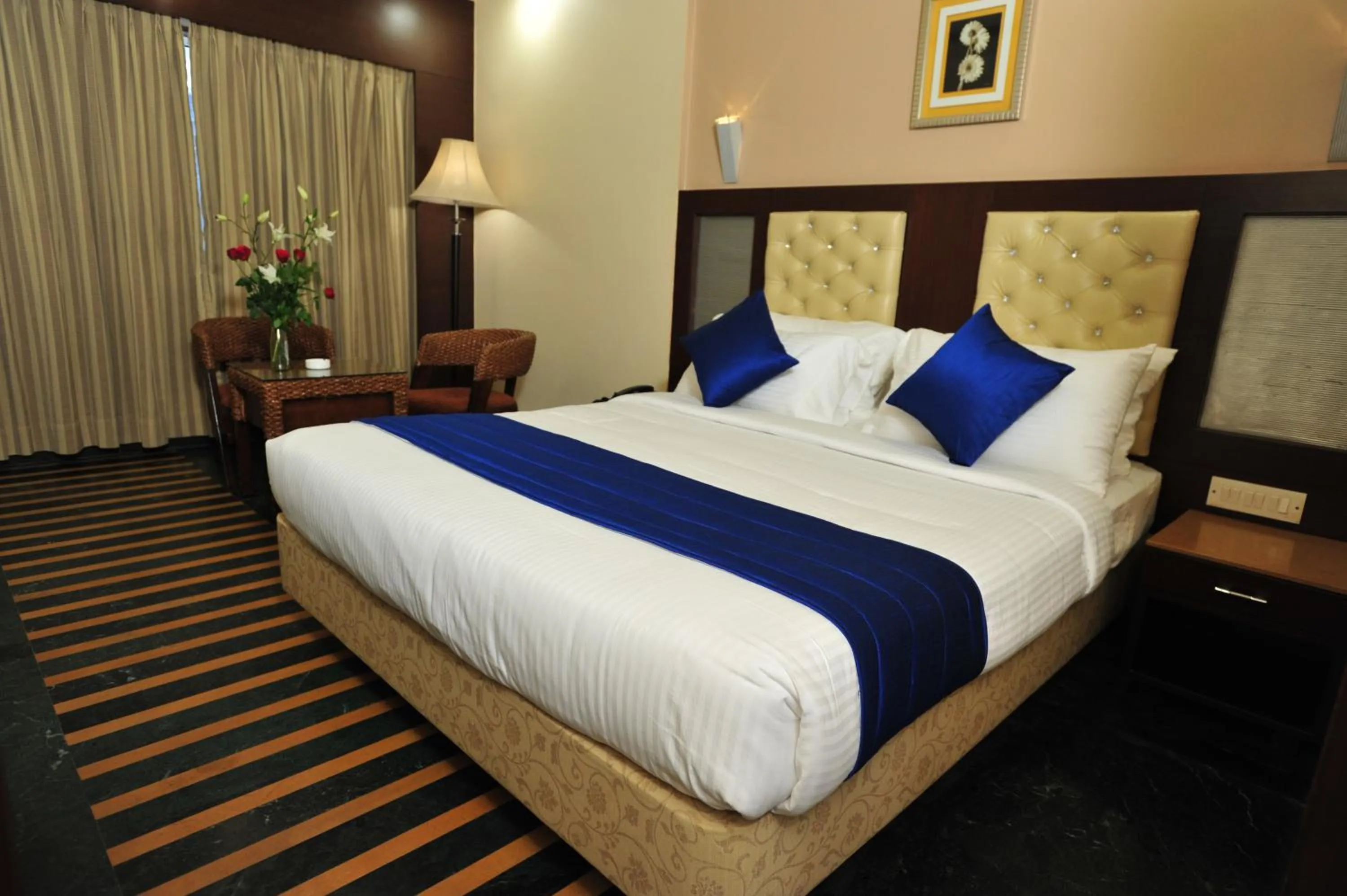Bed in Hotel Dr Rajkumar International