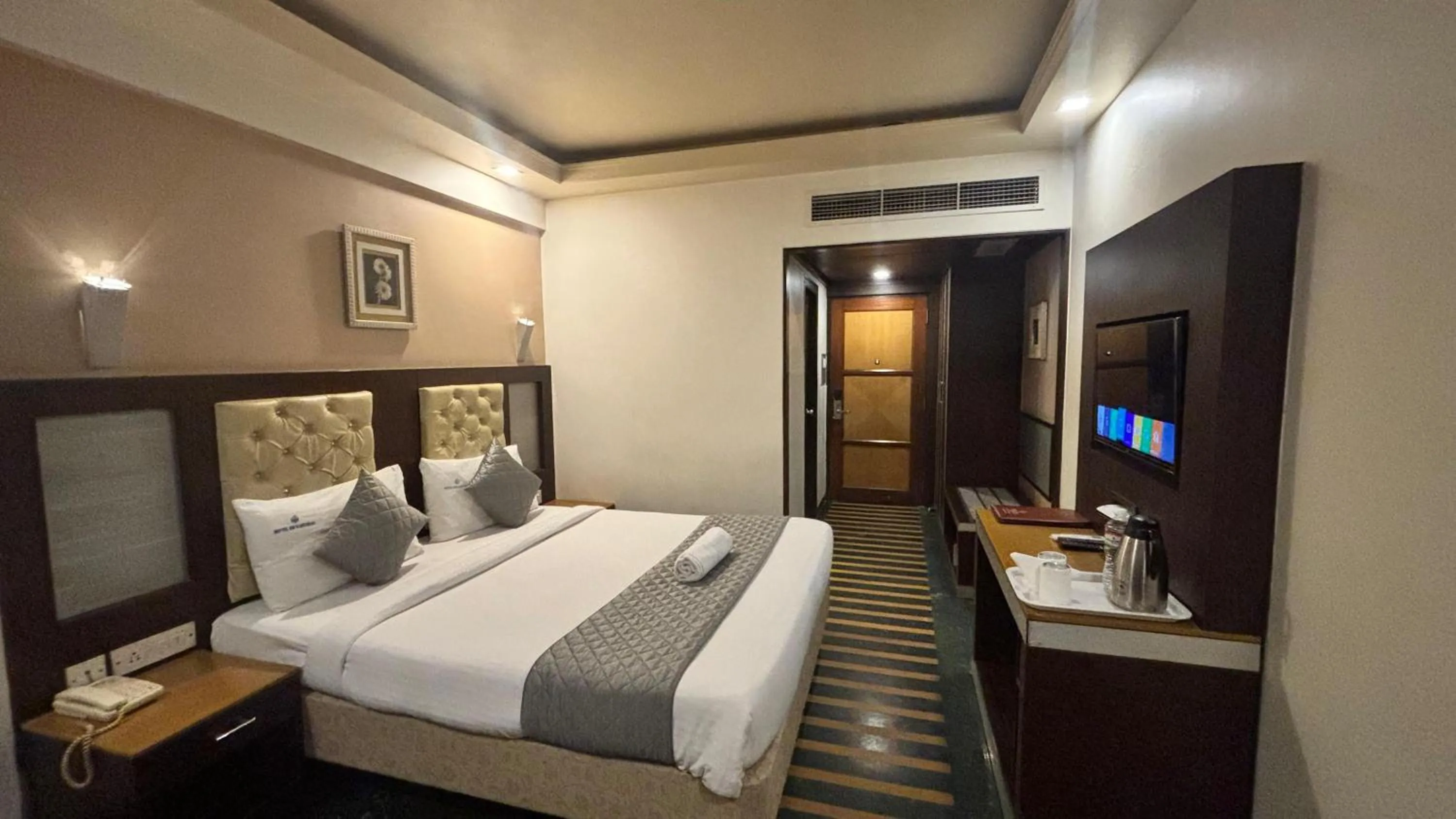 Bed in Hotel Dr Rajkumar International