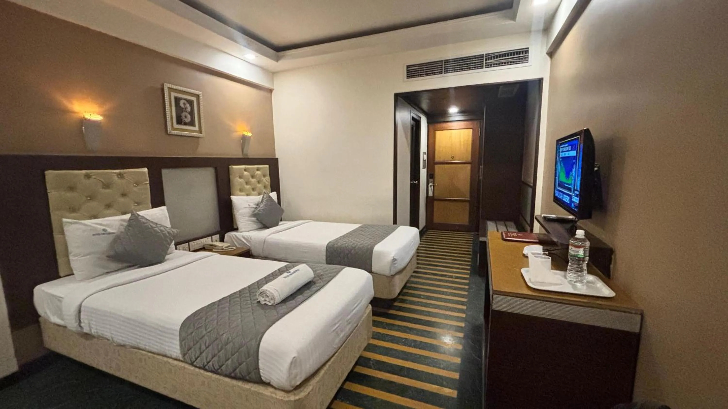 Bed in Hotel Dr Rajkumar International