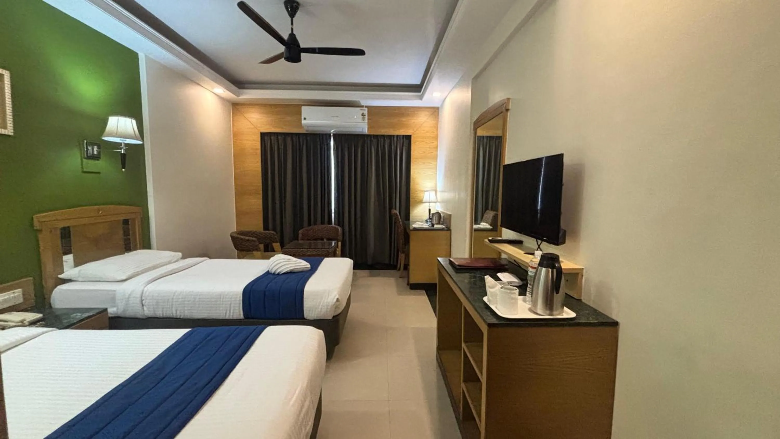 Communal lounge/ TV room, Bed in Hotel Dr Rajkumar International