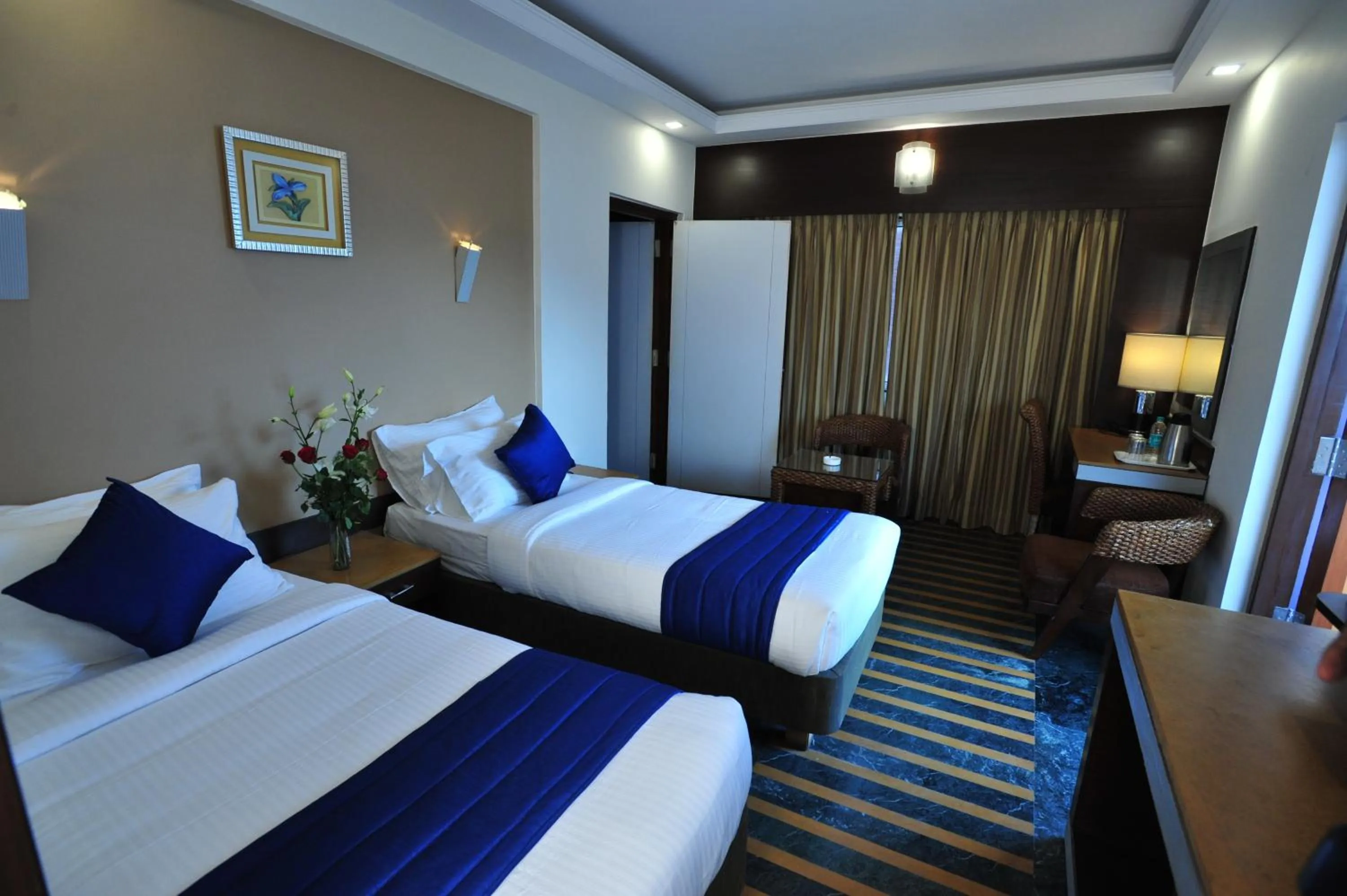 Bed in Hotel Dr Rajkumar International