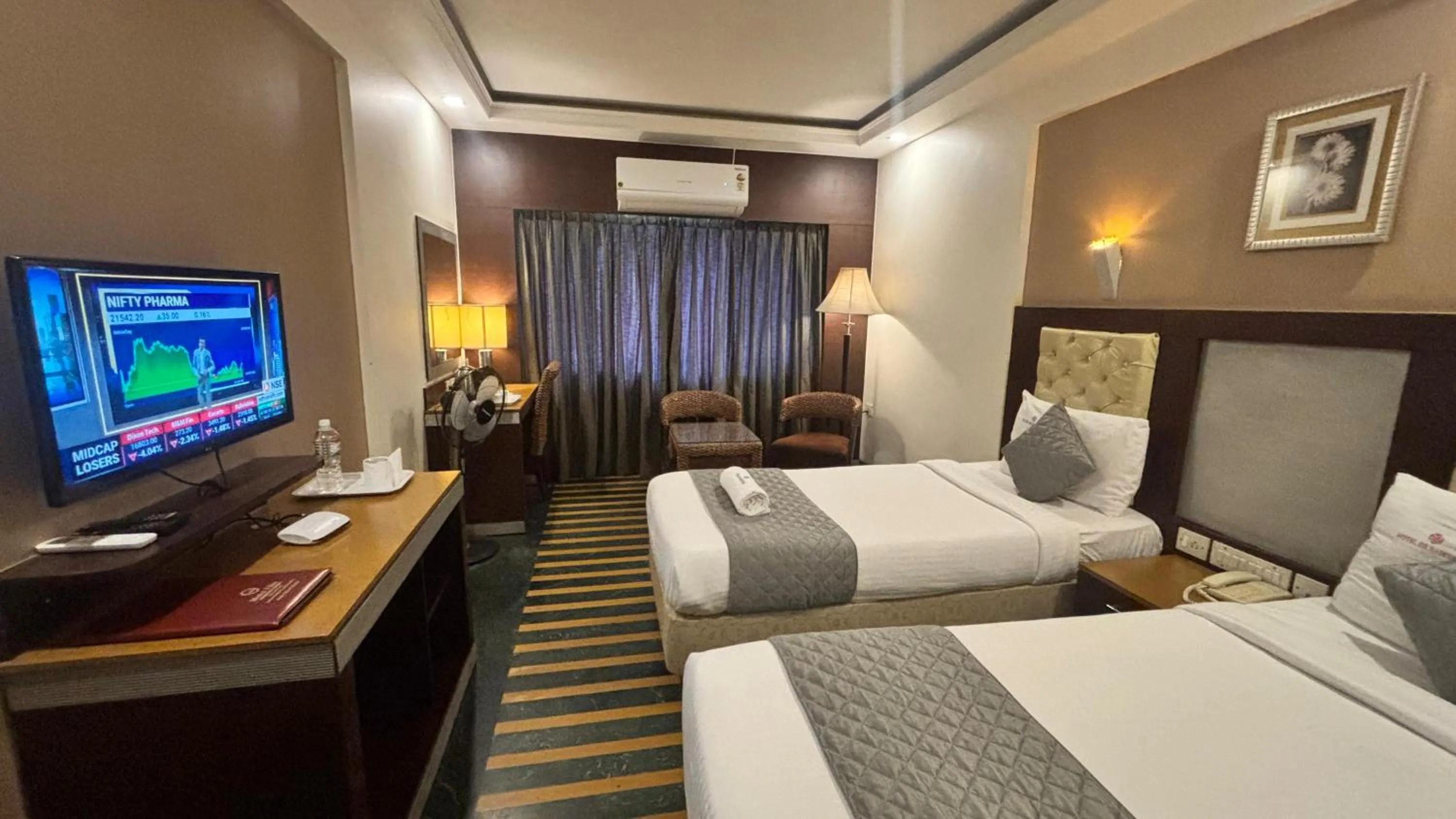 Bed in Hotel Dr Rajkumar International