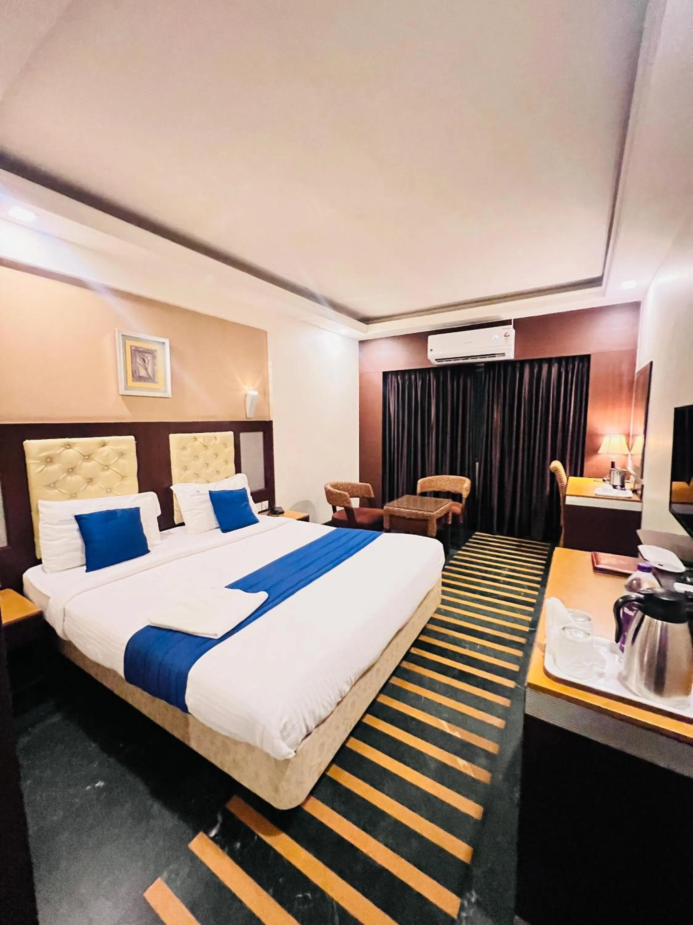 Bed in Hotel Dr Rajkumar International