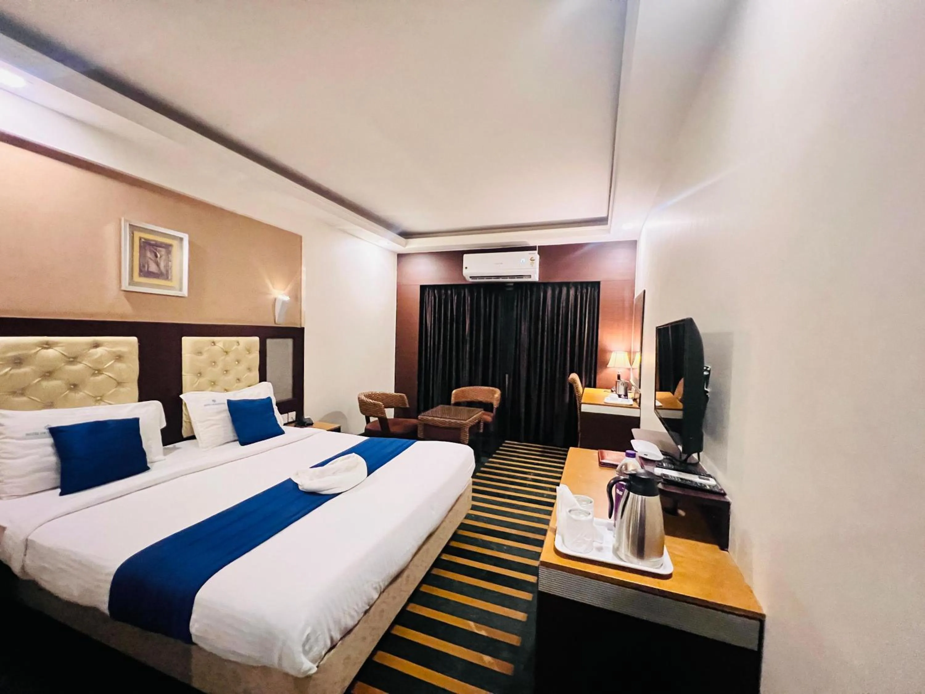 Bed in Hotel Dr Rajkumar International