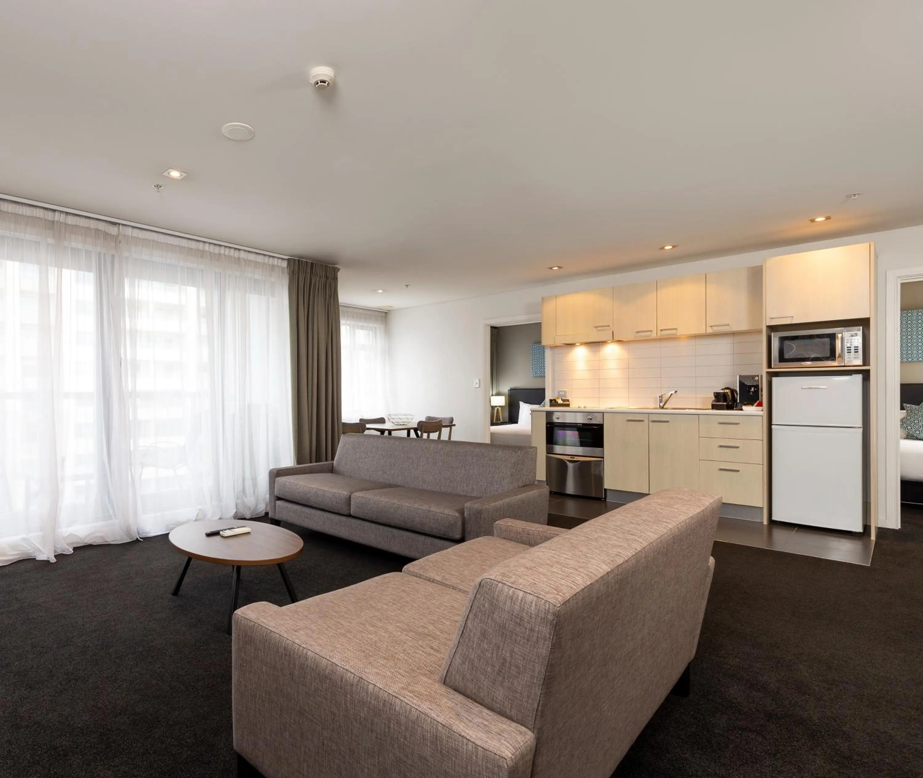 Living room in Oaks Auckland Hotel