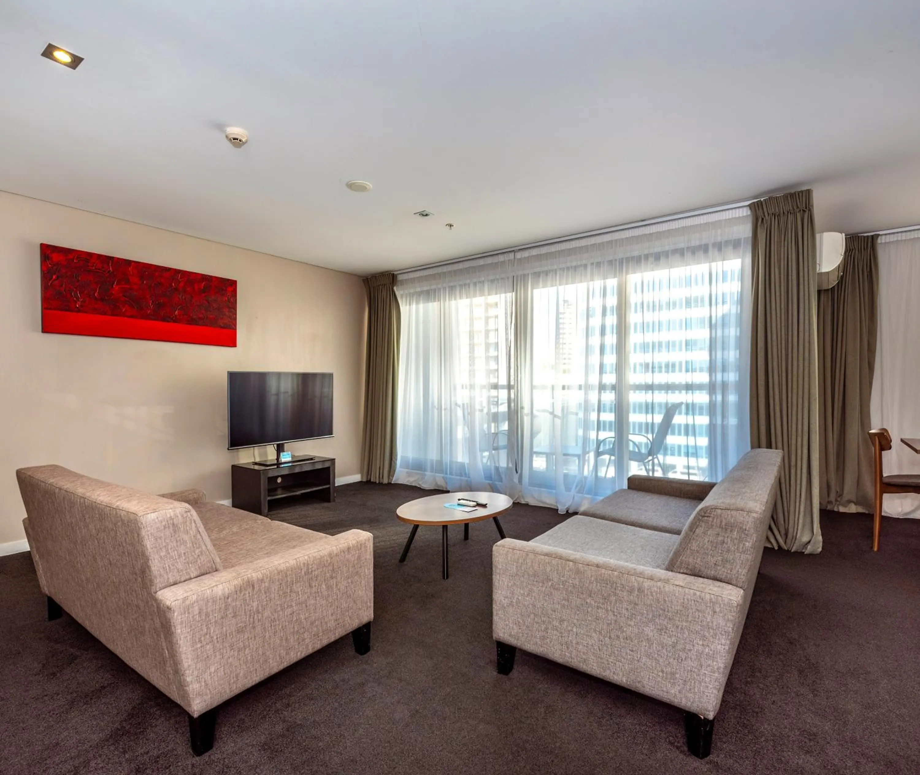 Living room in Oaks Auckland Hotel