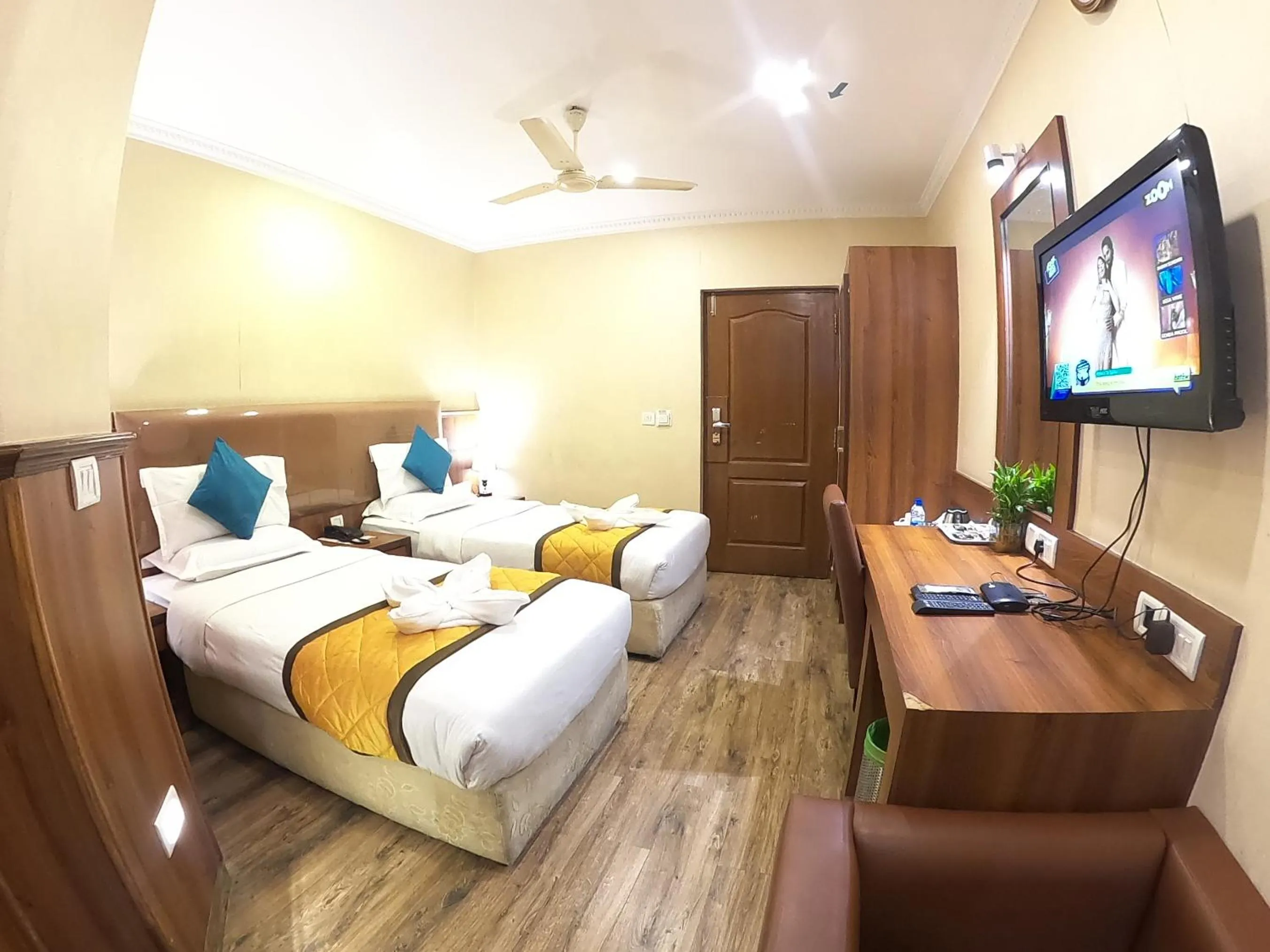 Bed in Hotel Noor Empire International Kormangala